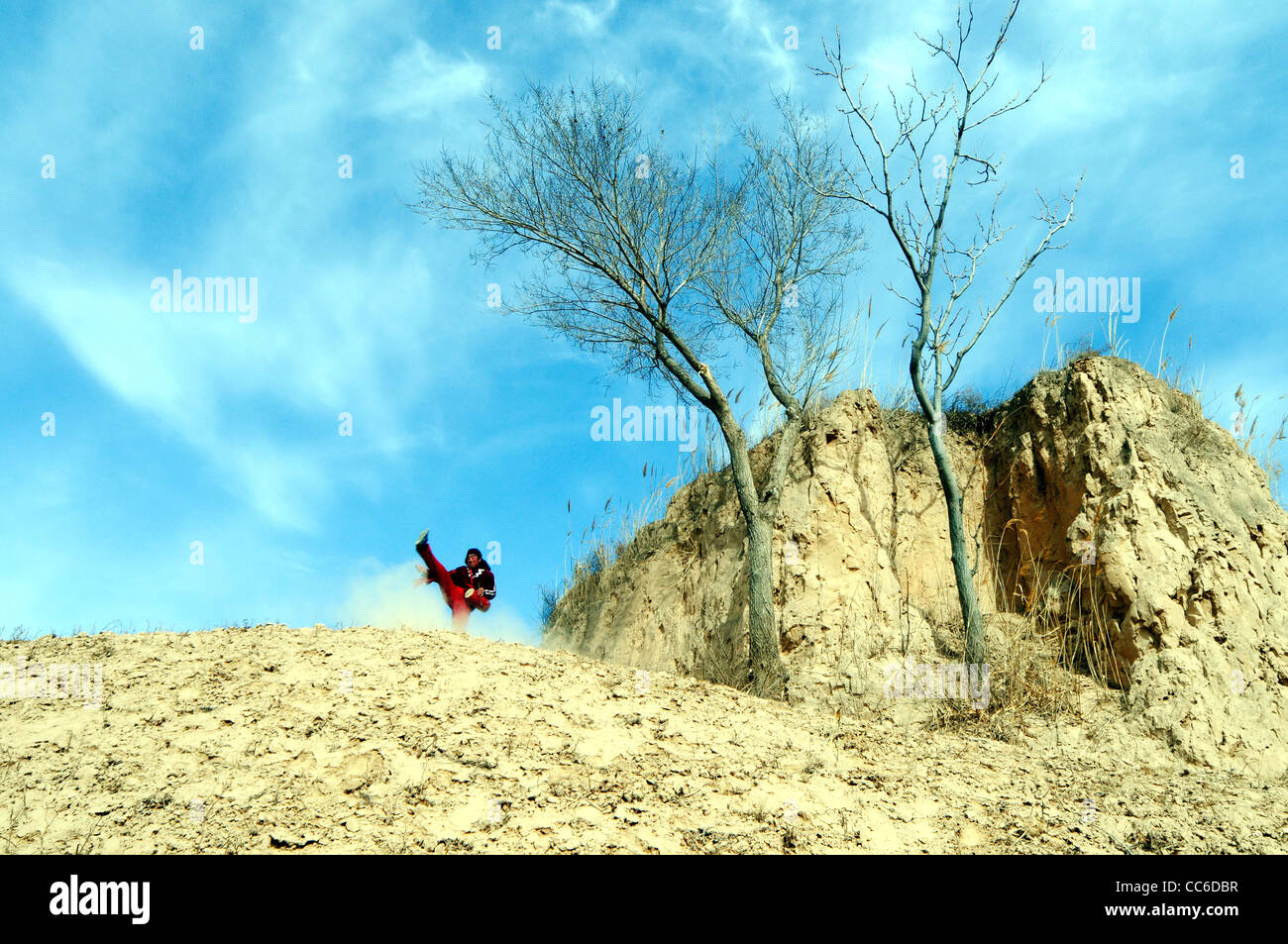 Man practicing waist drum dancing, Loess Plateau, Yulin, Shaanxi Pronvince, China Stock Photo