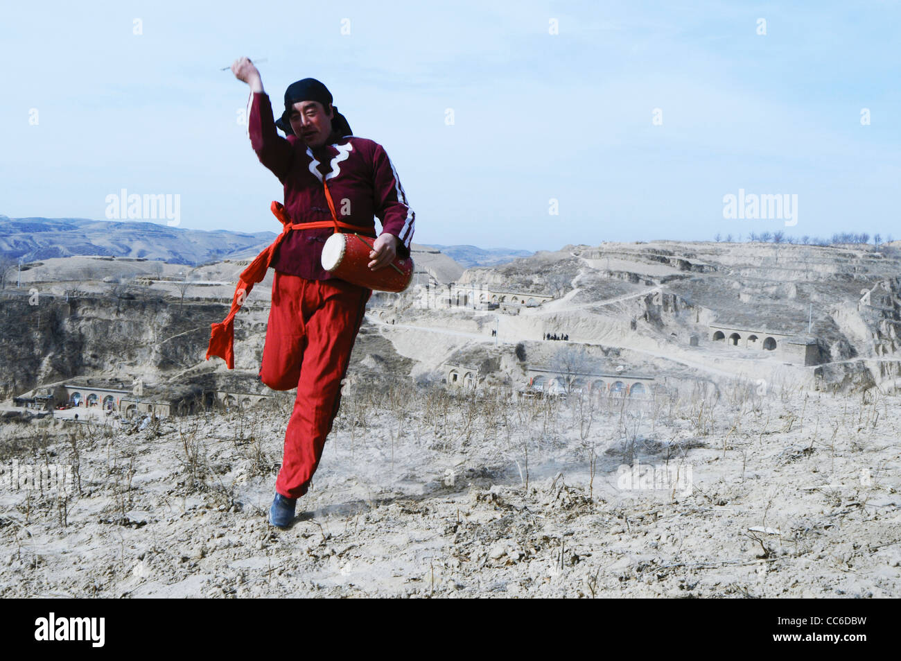 Man practicing waist drum dancing, Loess Plateau, Yulin, Shaanxi Pronvince, China Stock Photo