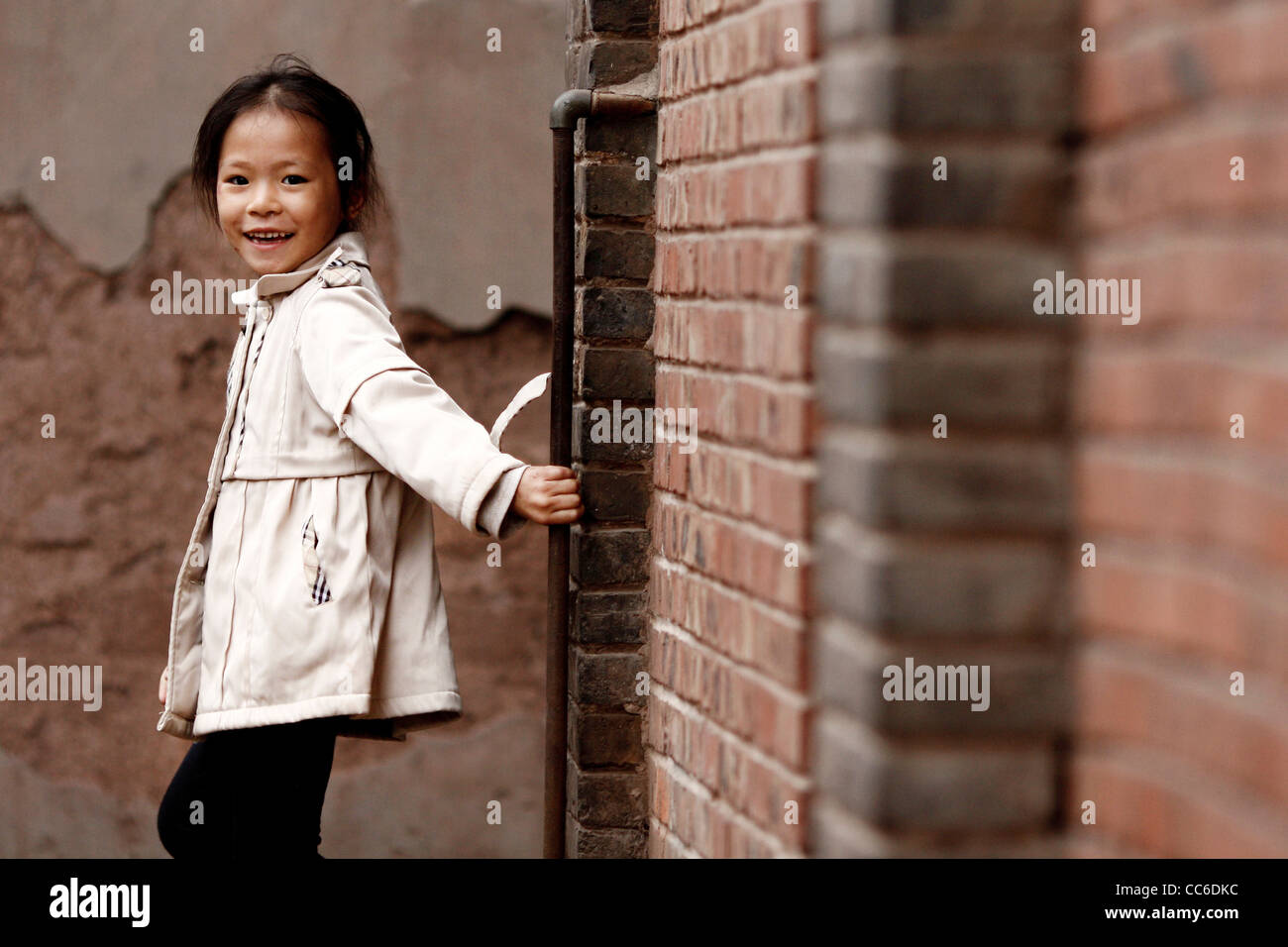 Smiling girl looking at camera, Fubao Ancient Town, Luzhou, Sichuan