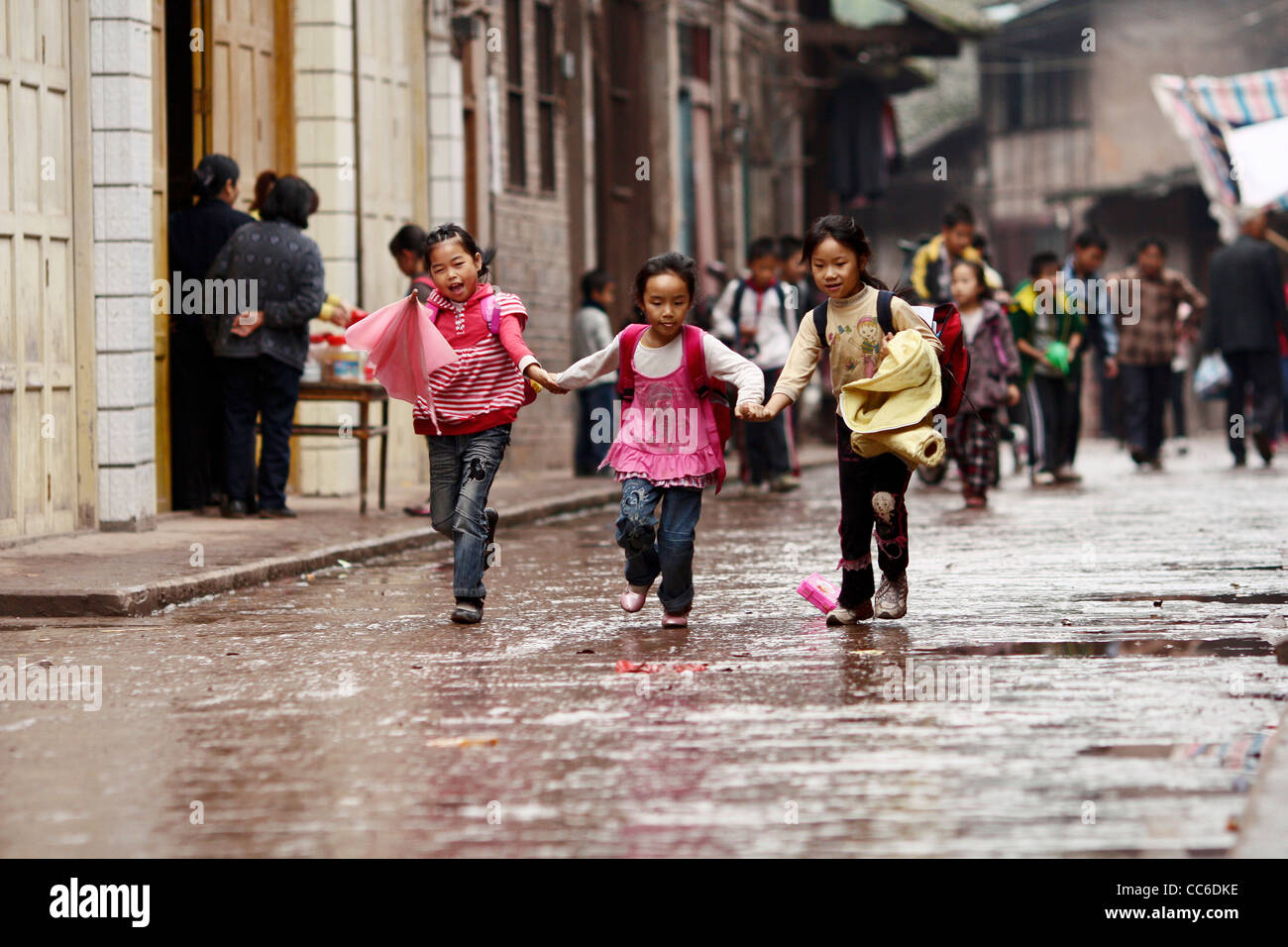 Children go to school together, Fubao Ancient Town, Luzhou, Sichuan , China Stock Photo