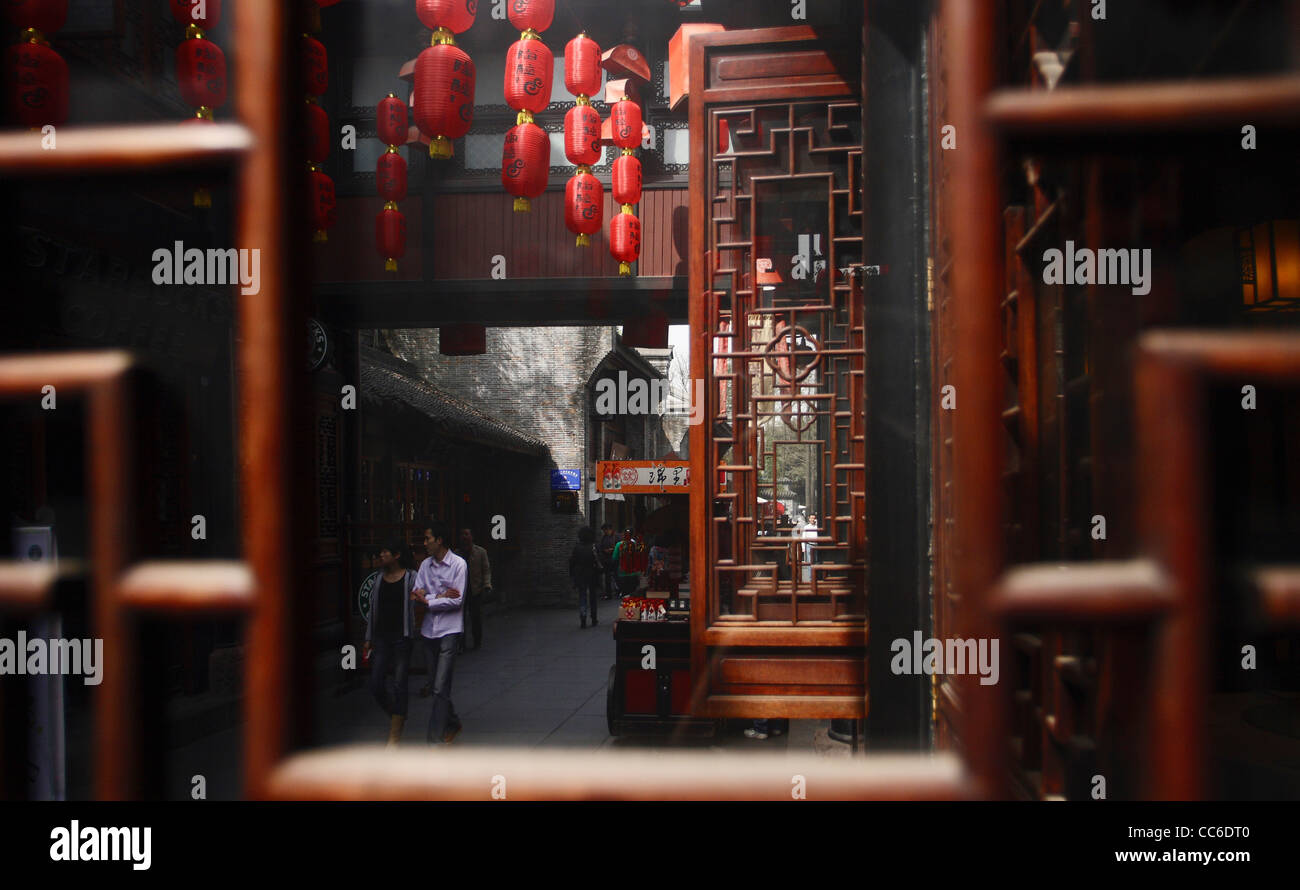 View through a lattice window towards the lane, Jinli Street, Chengdu, Sichuan , China Stock Photo