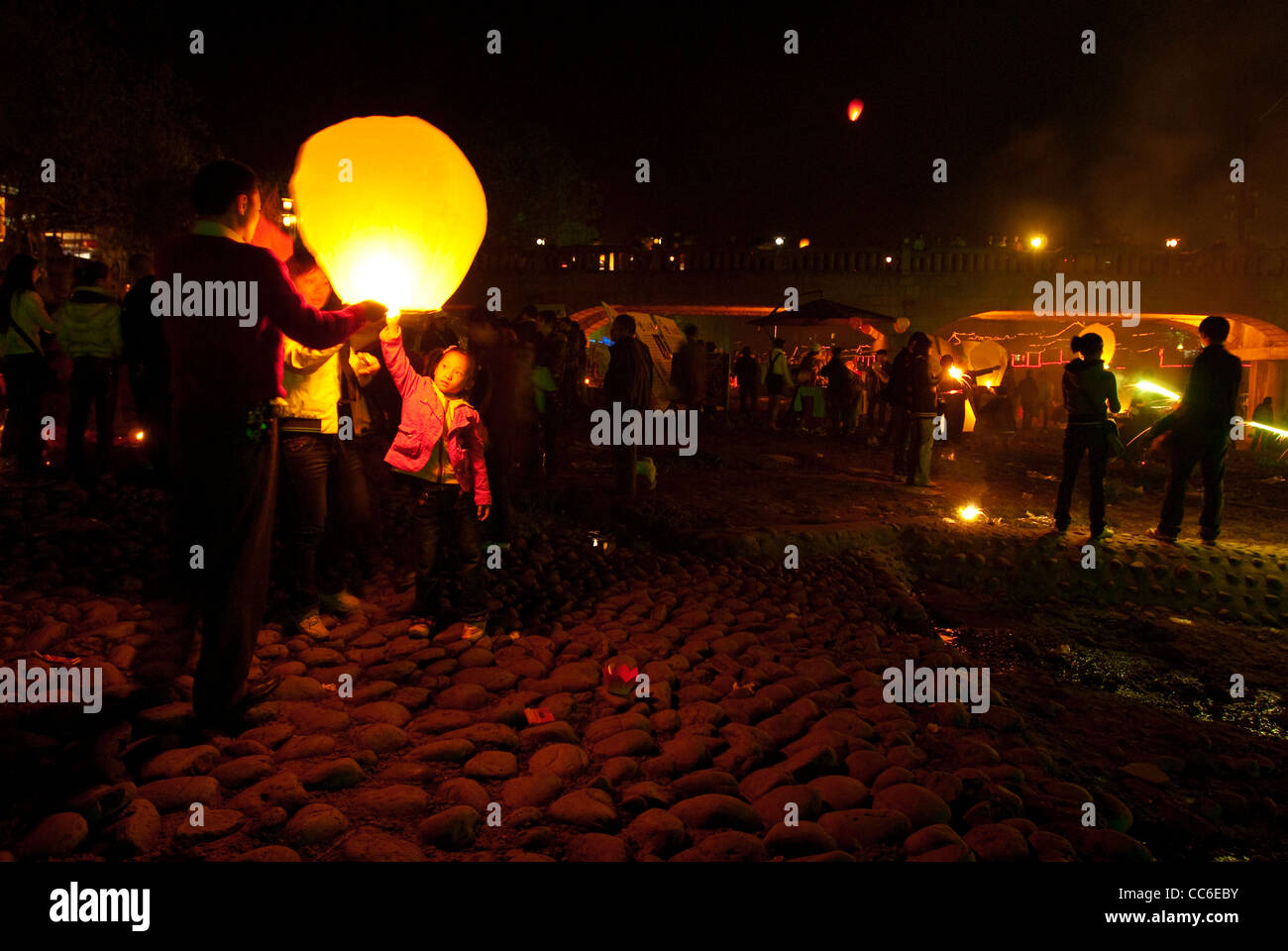 People release of a sky lantern during Lantern Festival, Pingle Ancient Town, Chengdu, Sichuan