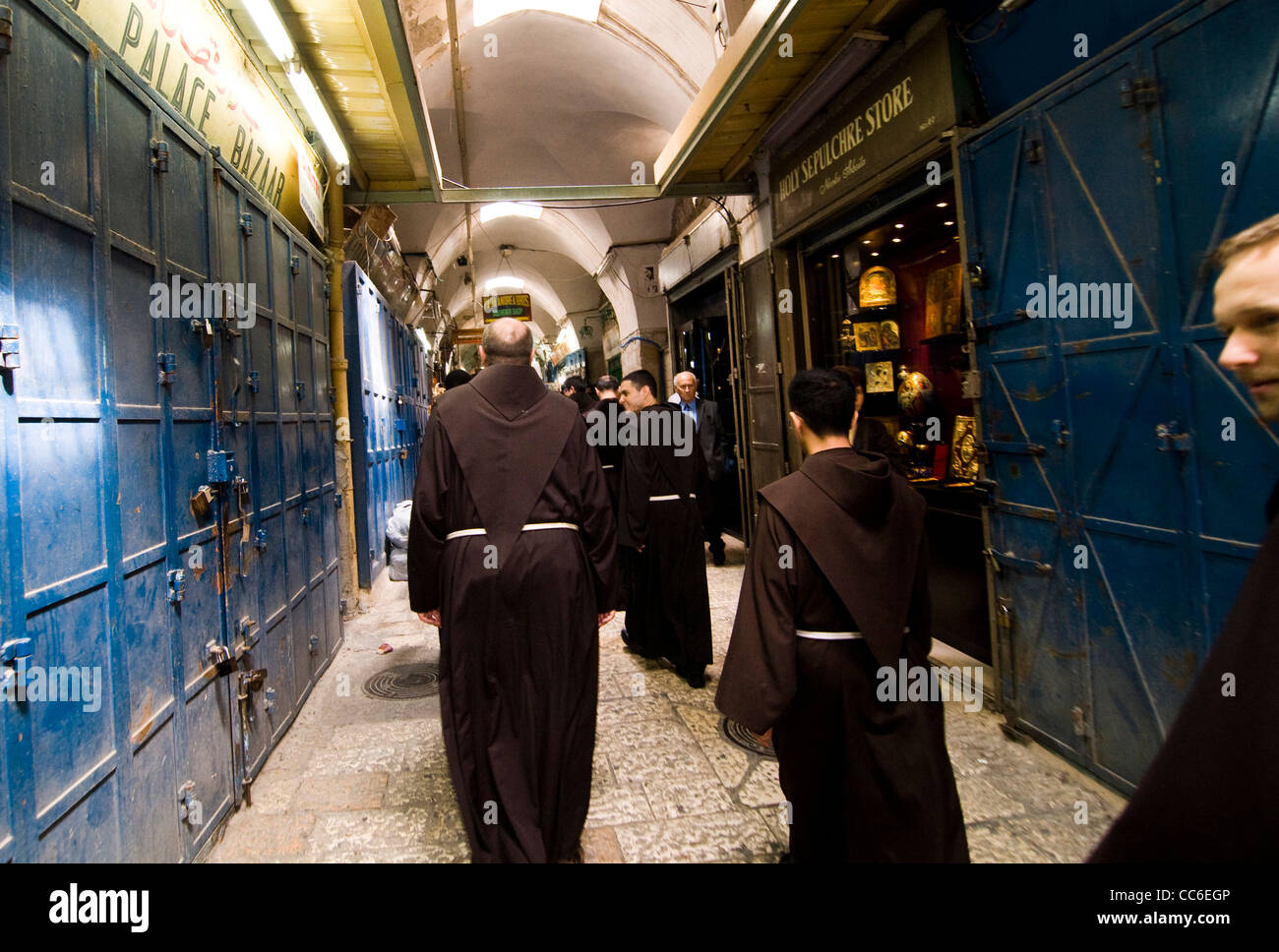 Franciscan monks walking through the narrow streets of the old city in Jerusalem. Stock Photo