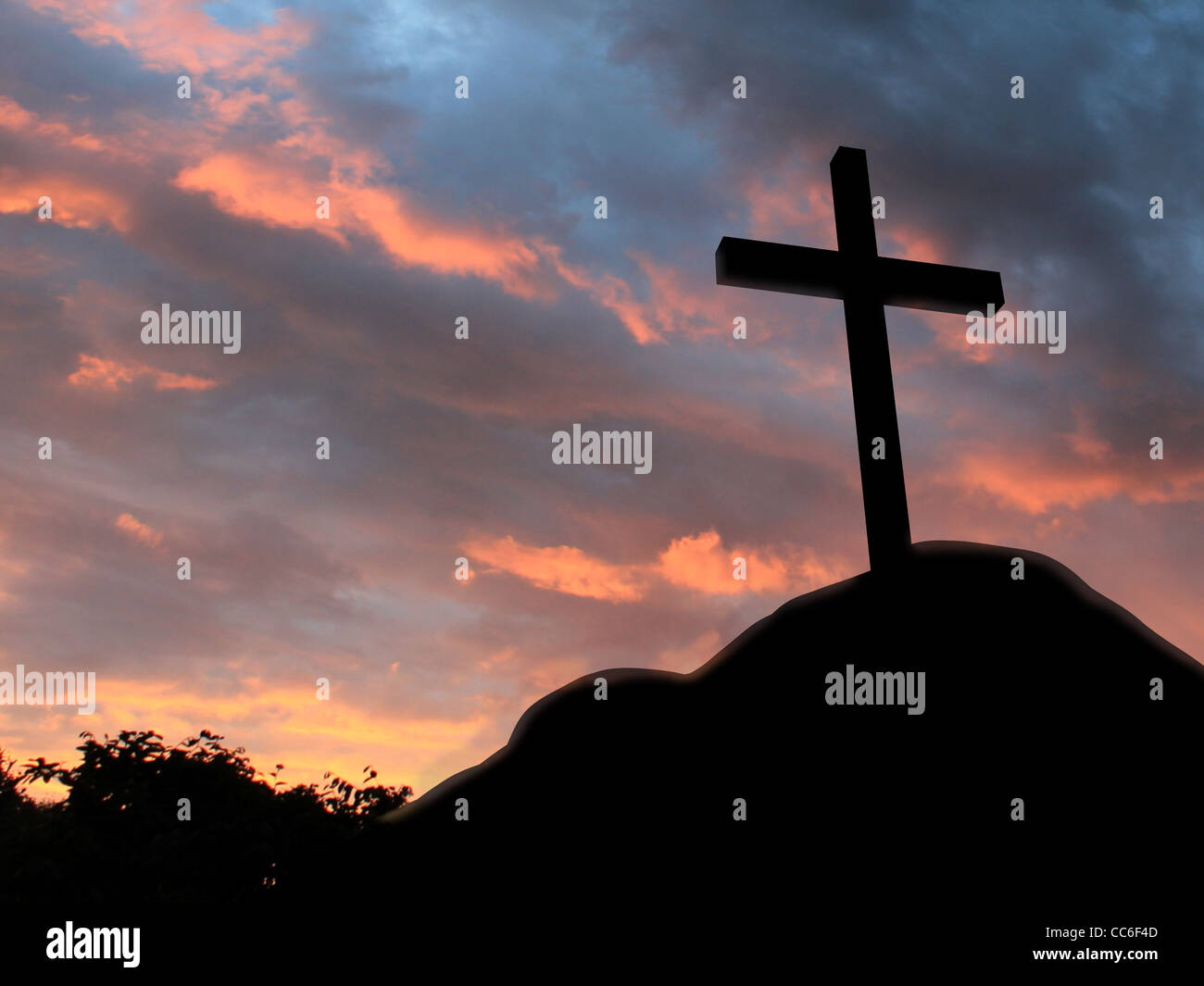Cross on a hill with cloudy background Stock Photo