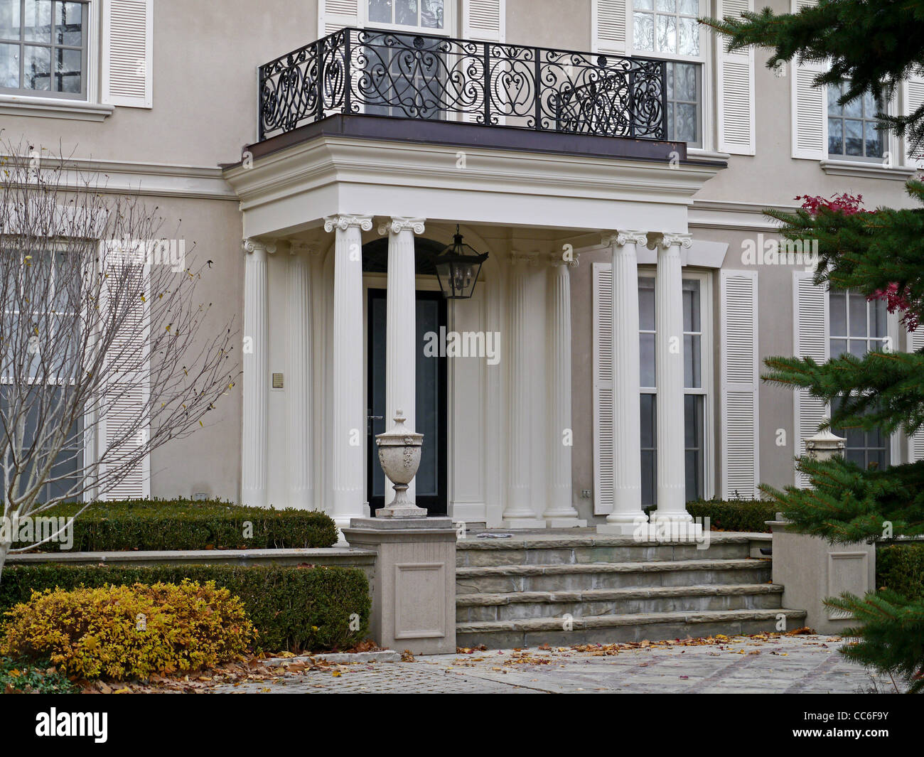 Front portico entrance of large house Stock Photo