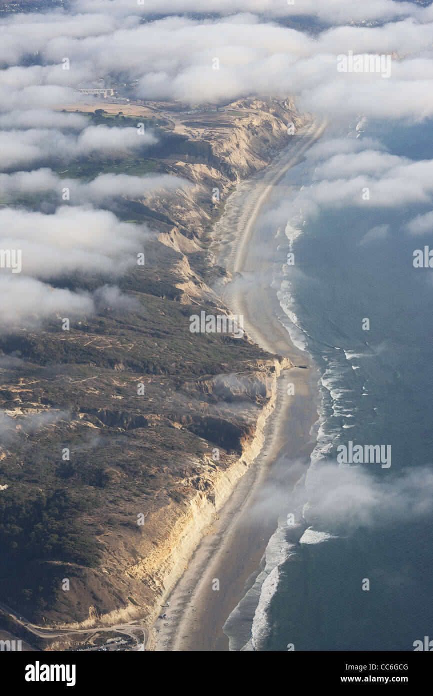 AERIAL VIEW. Cliffs shrouded in the summer coastal fog. Torrey Pines Cliffs, San Diego County, California, USA. Stock Photo
