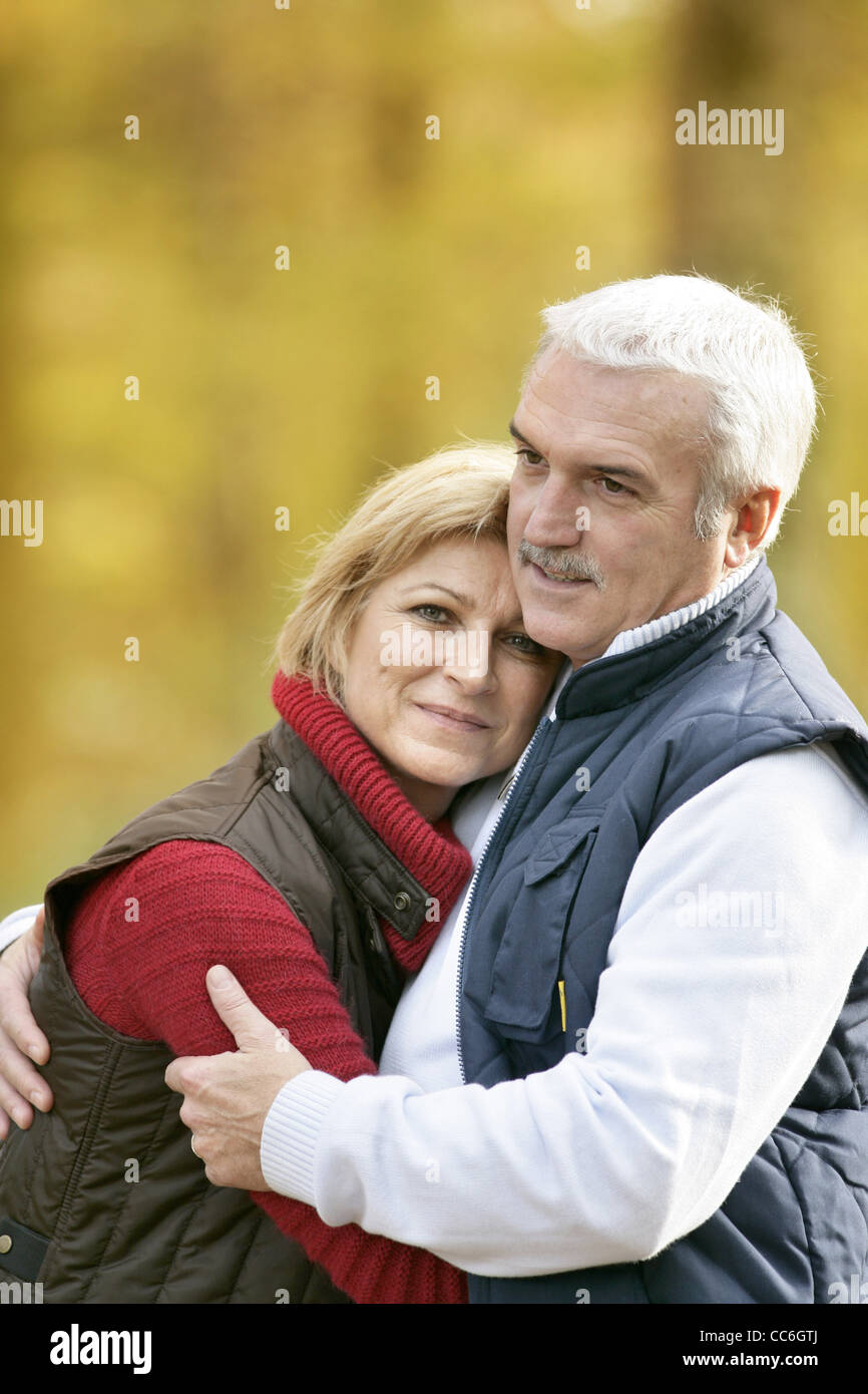 Mature couple on an autumn walk Stock Photo - Alamy