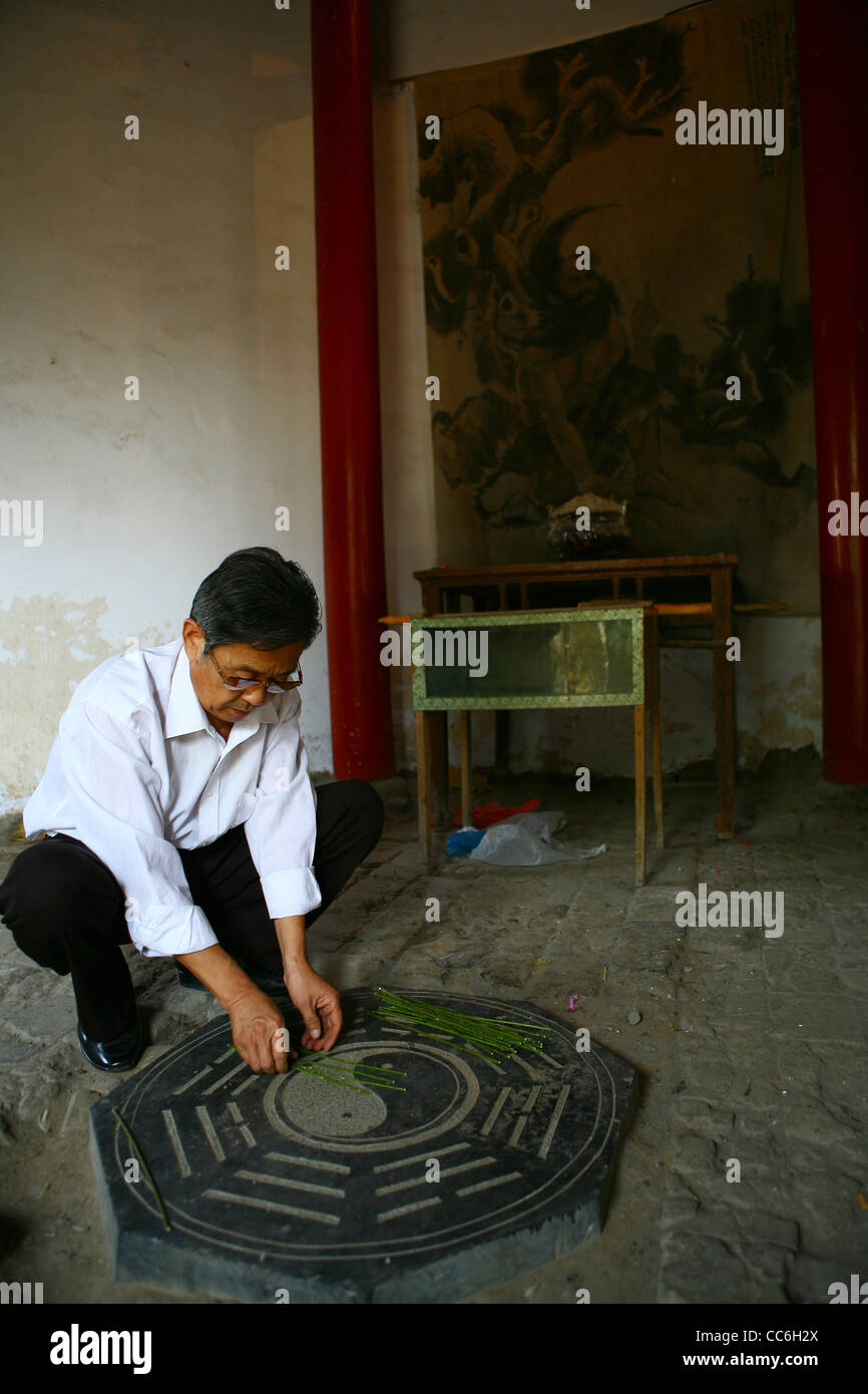 Local man divining, Fuxi Divinatory Pavilion, Shangcai, Henan , China Stock Photo