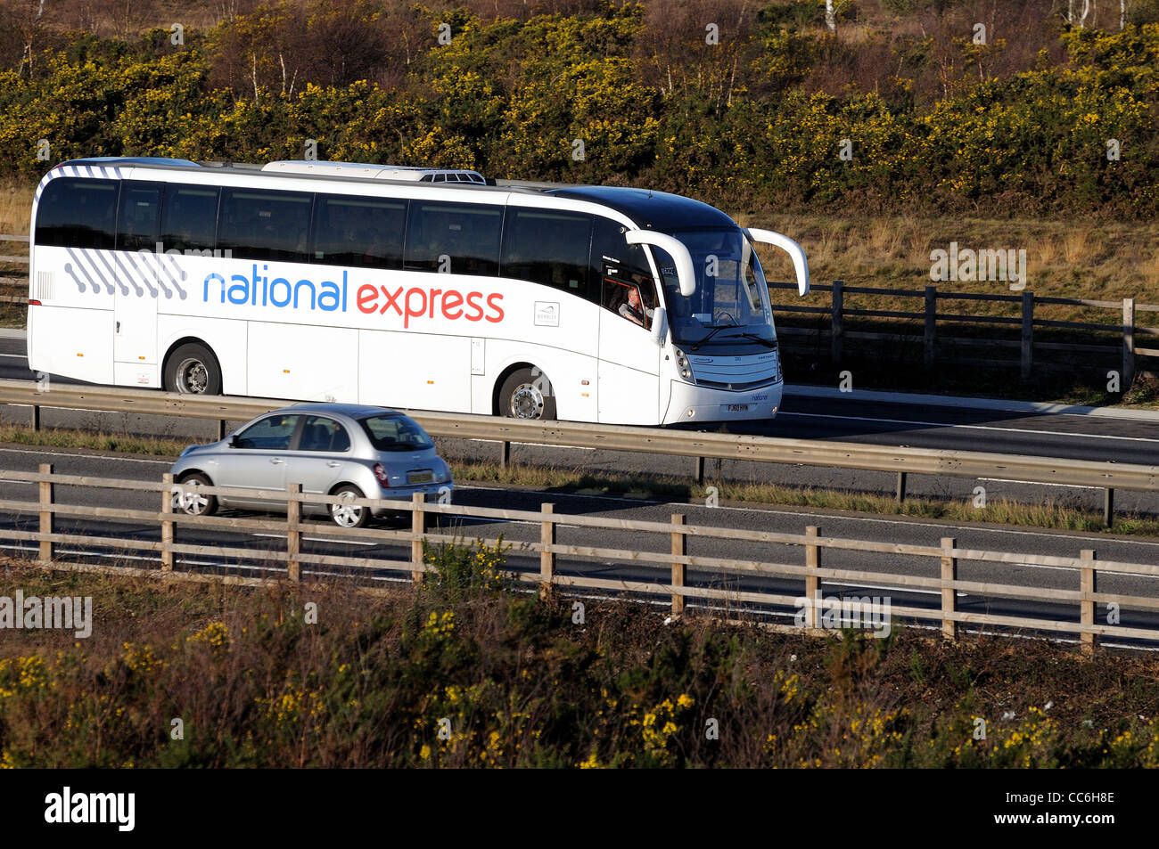 Speeding National Express coach on M3 motorway Stock Photo