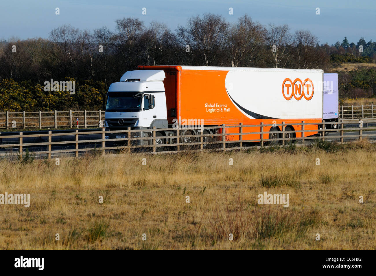 Speeding TNT delivery lorry on motorway Stock Photo