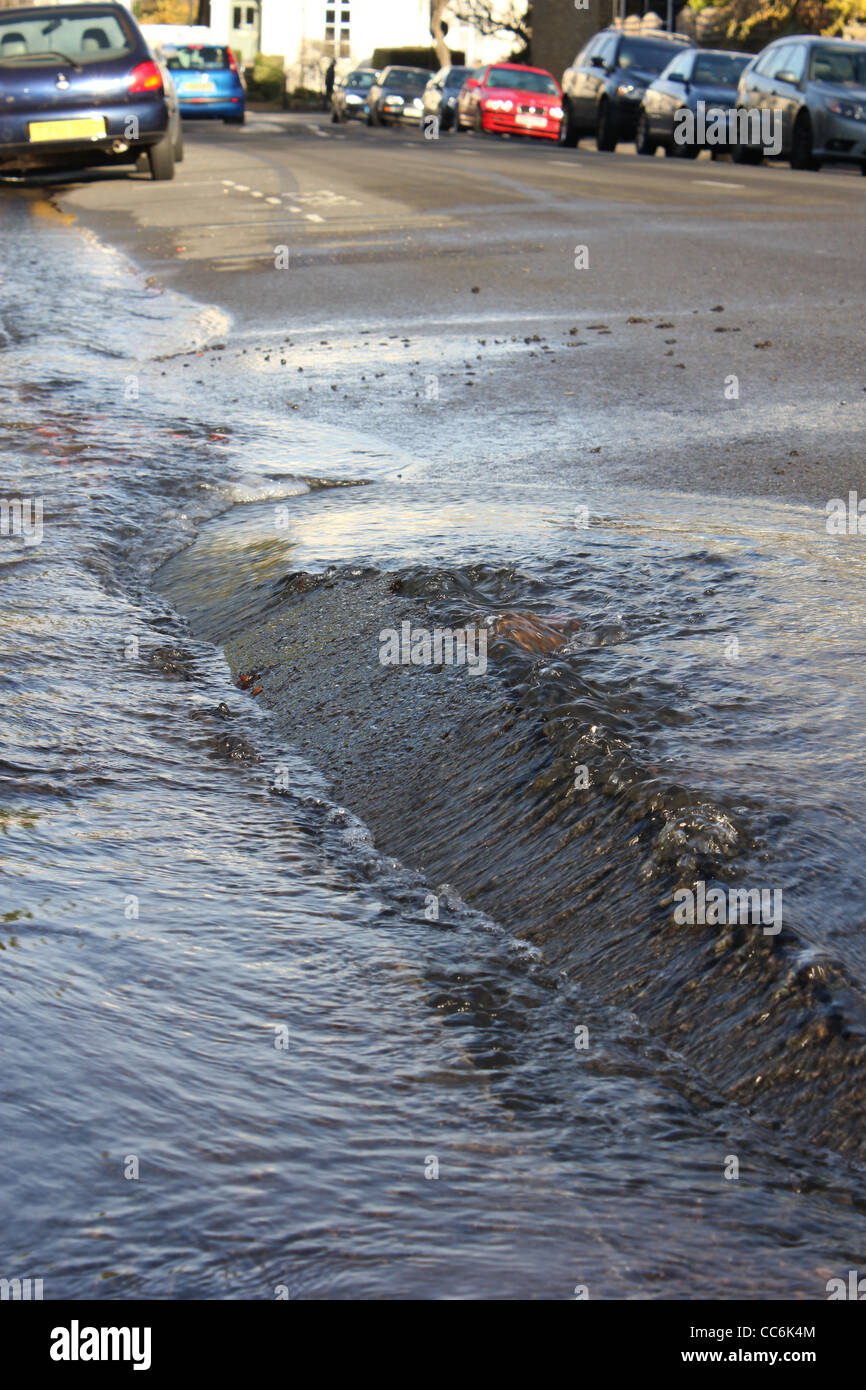 Burst water main on street in London Stock Photo Alamy