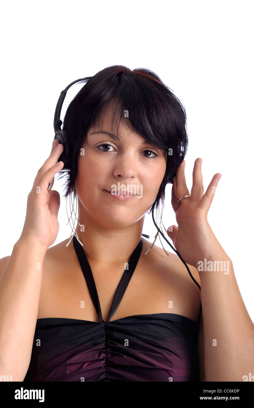 young woman listening to music with earphones. isolated on white