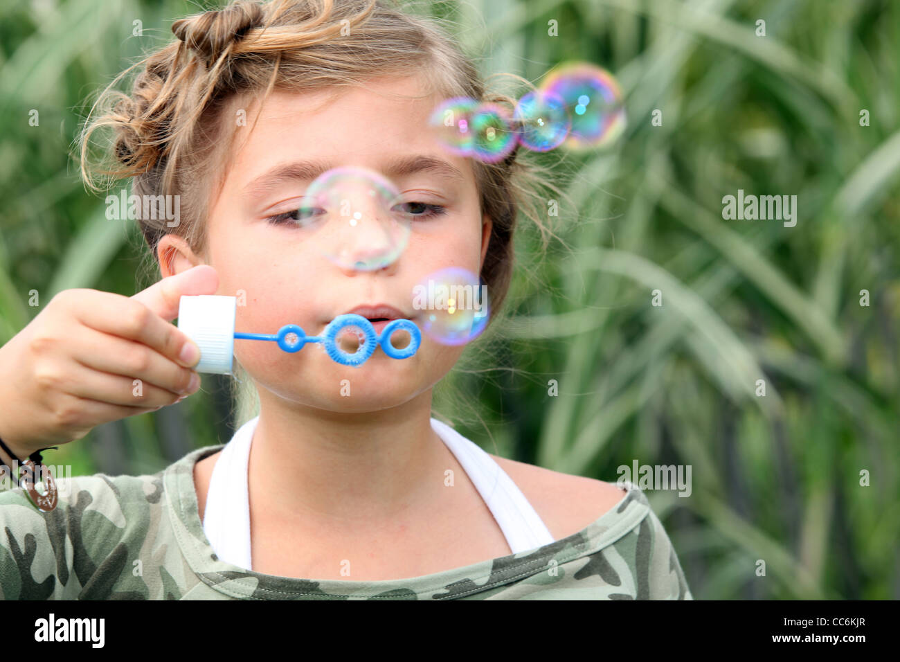 Girl Blowing Bubbles Stock Photo Alamy