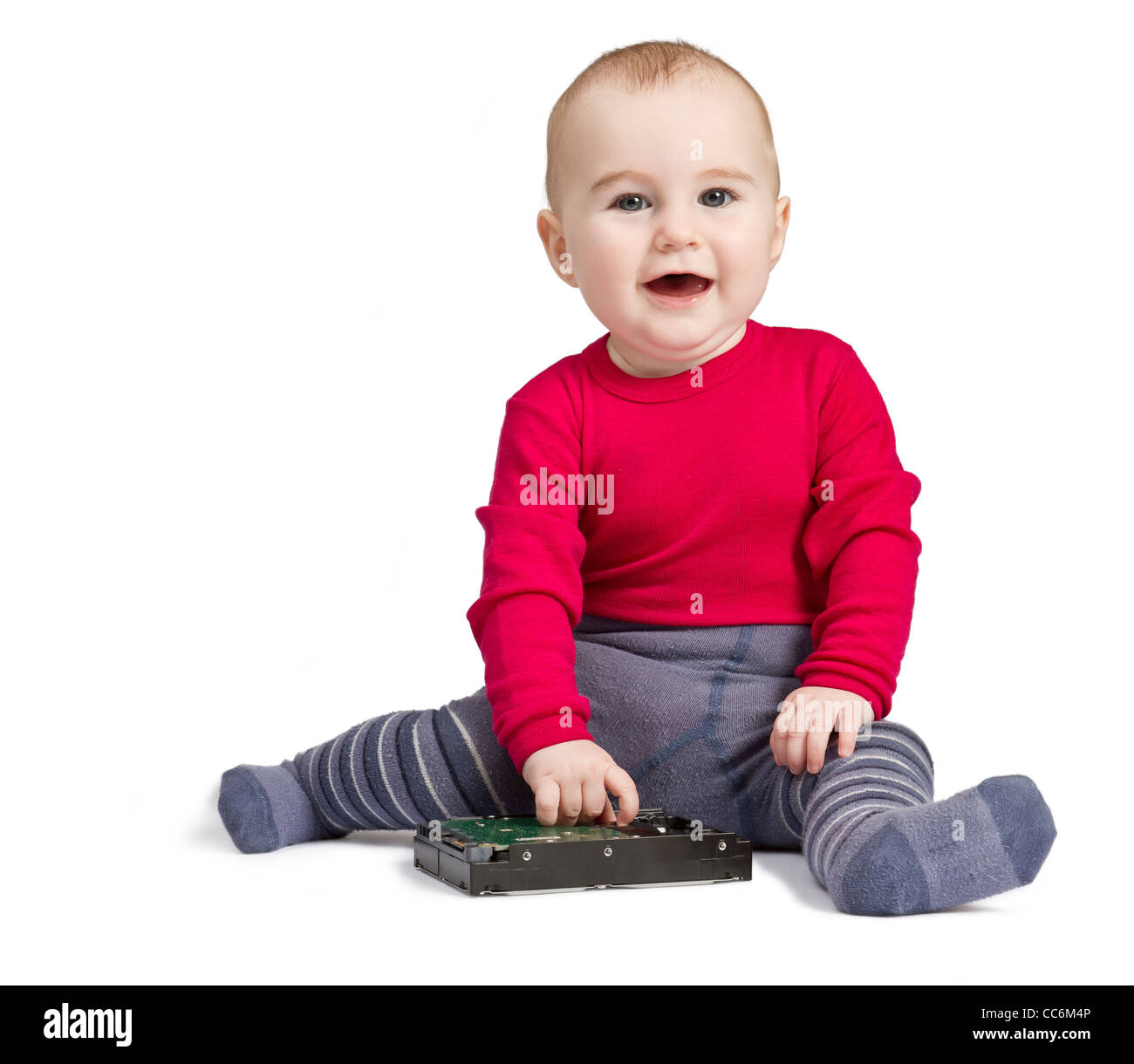 young child in white background with hard drive. red shirt and blue trousers Stock Photo
