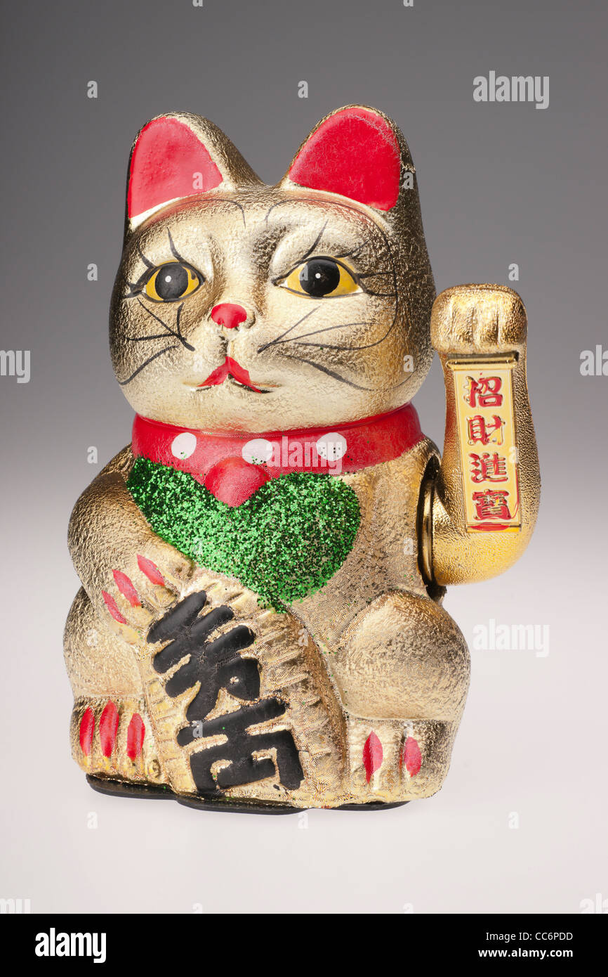 Maneki Neko the beckoning cat Japanese good fortune charm with