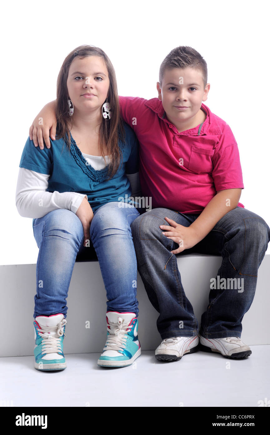 Brother and sister . Arms around shoulders Stock Photo