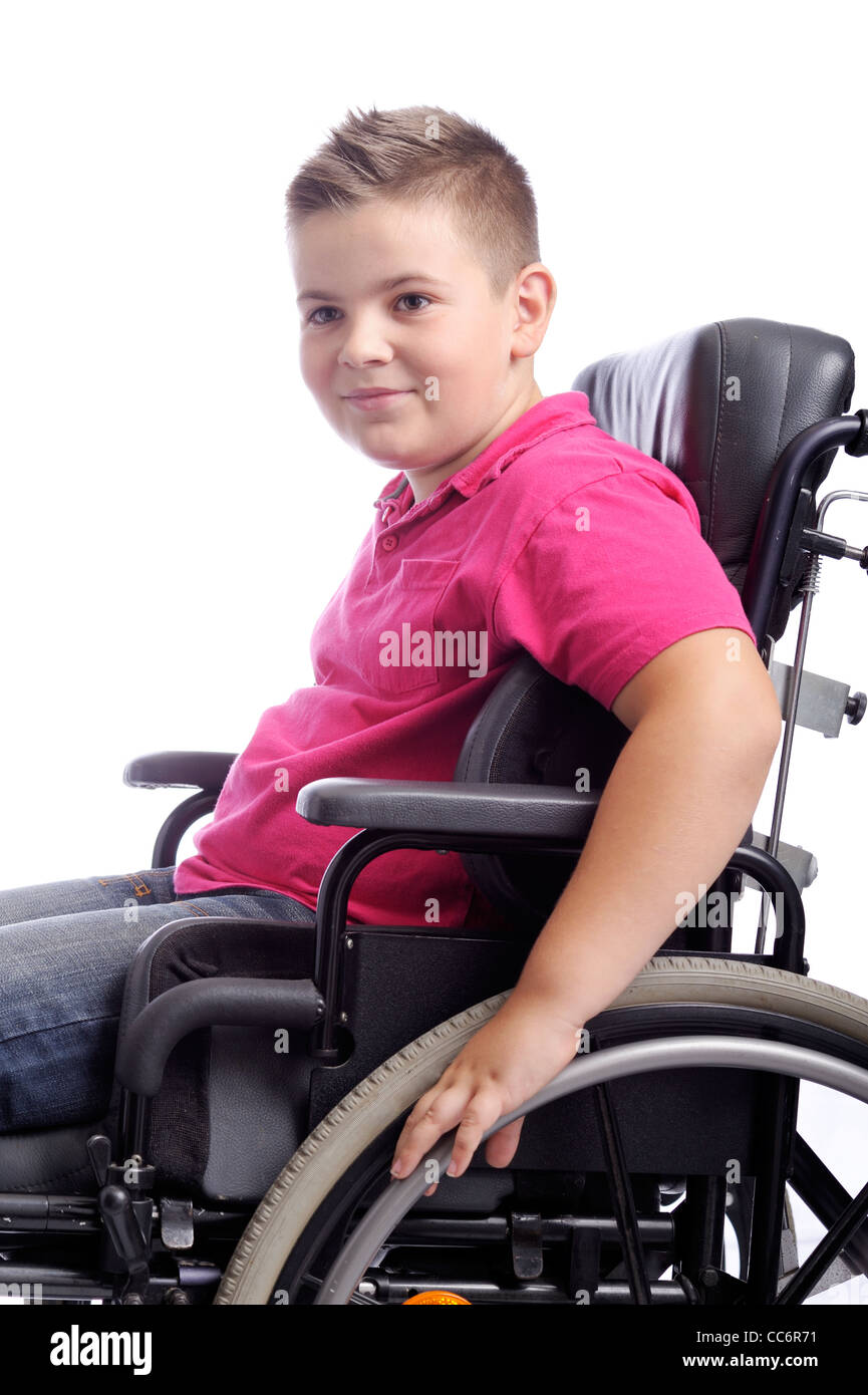 young boy in wheelchair . isolated on white background Stock Photo