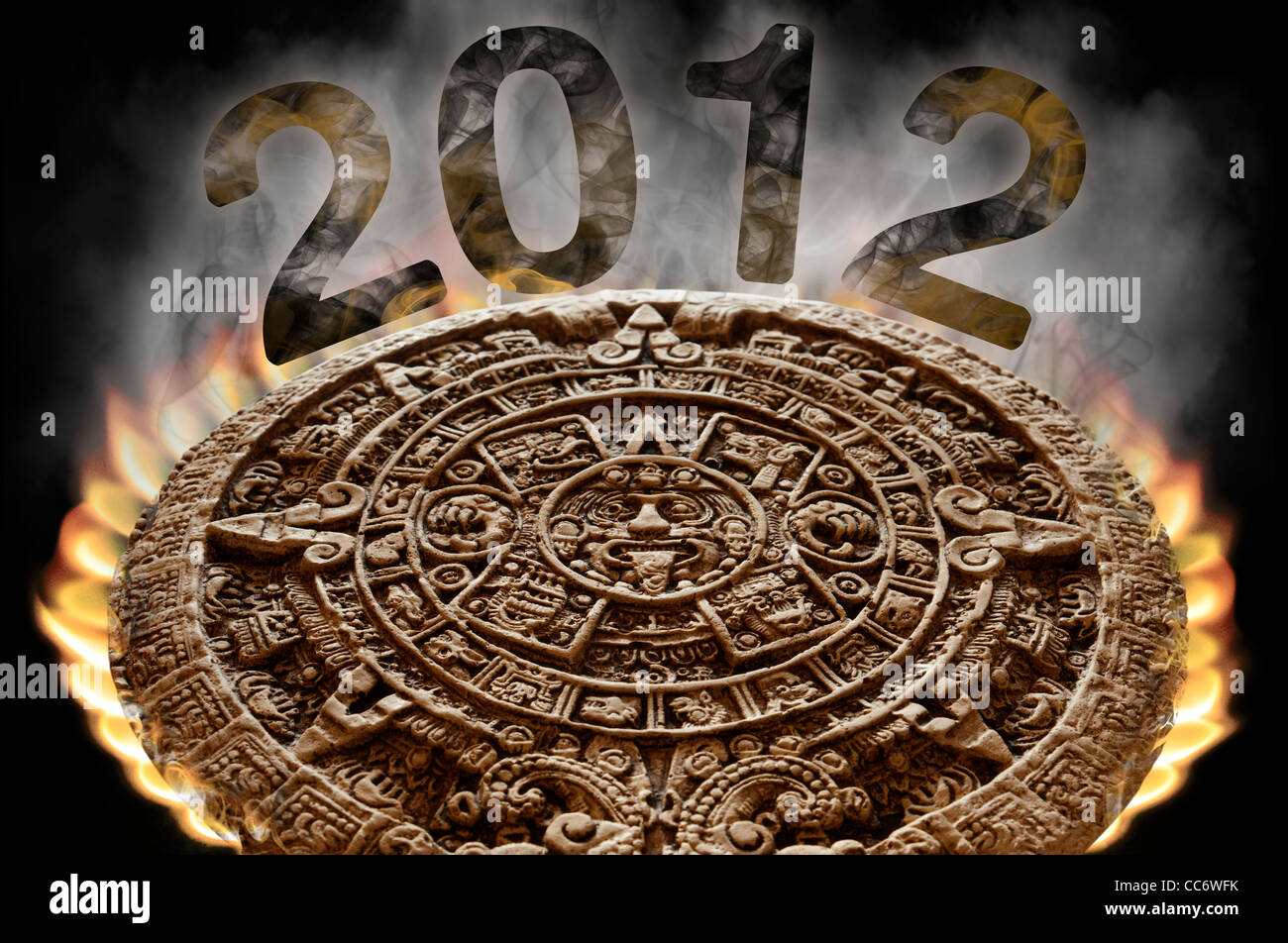 Apocalyptic Mayan Calendar on fire with smoke rising from its surface and 2012 visible in the smoke on a black background. Stock Photo