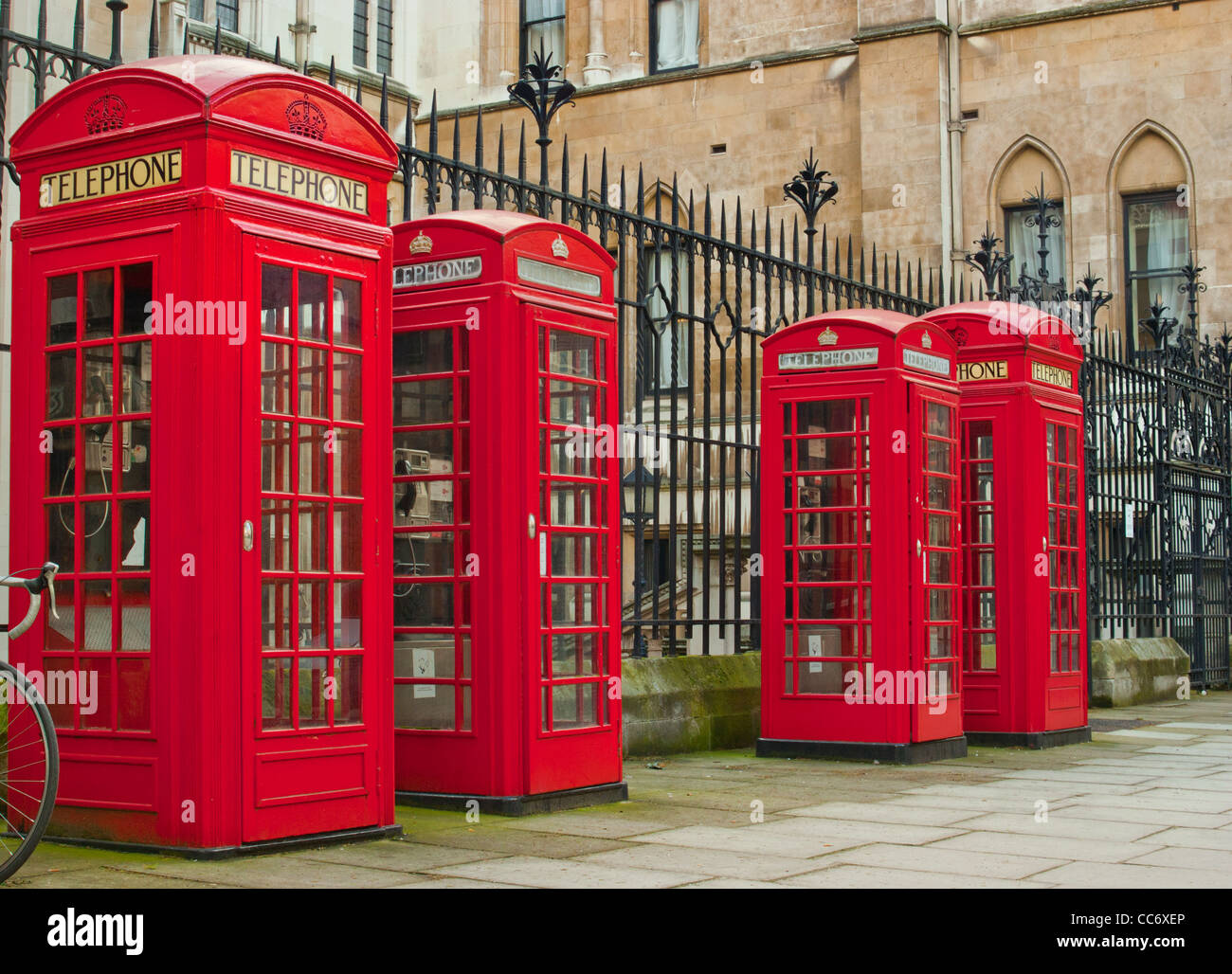 Four classic red  telephone boxes in the City of London. Stock Photo