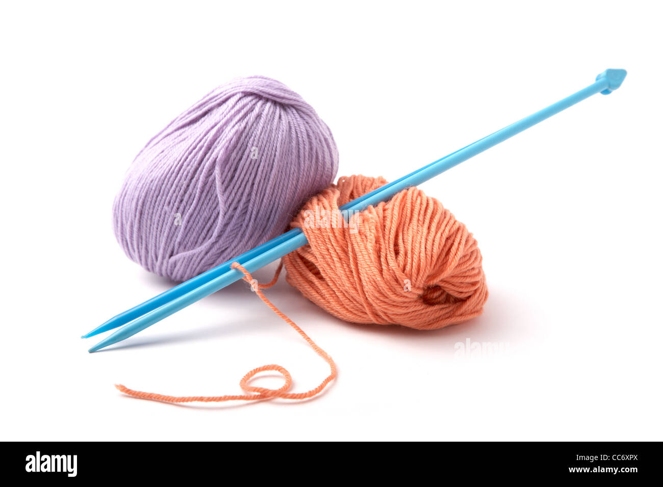 Balls of a yarn knitting spokes on white background Stock Photo