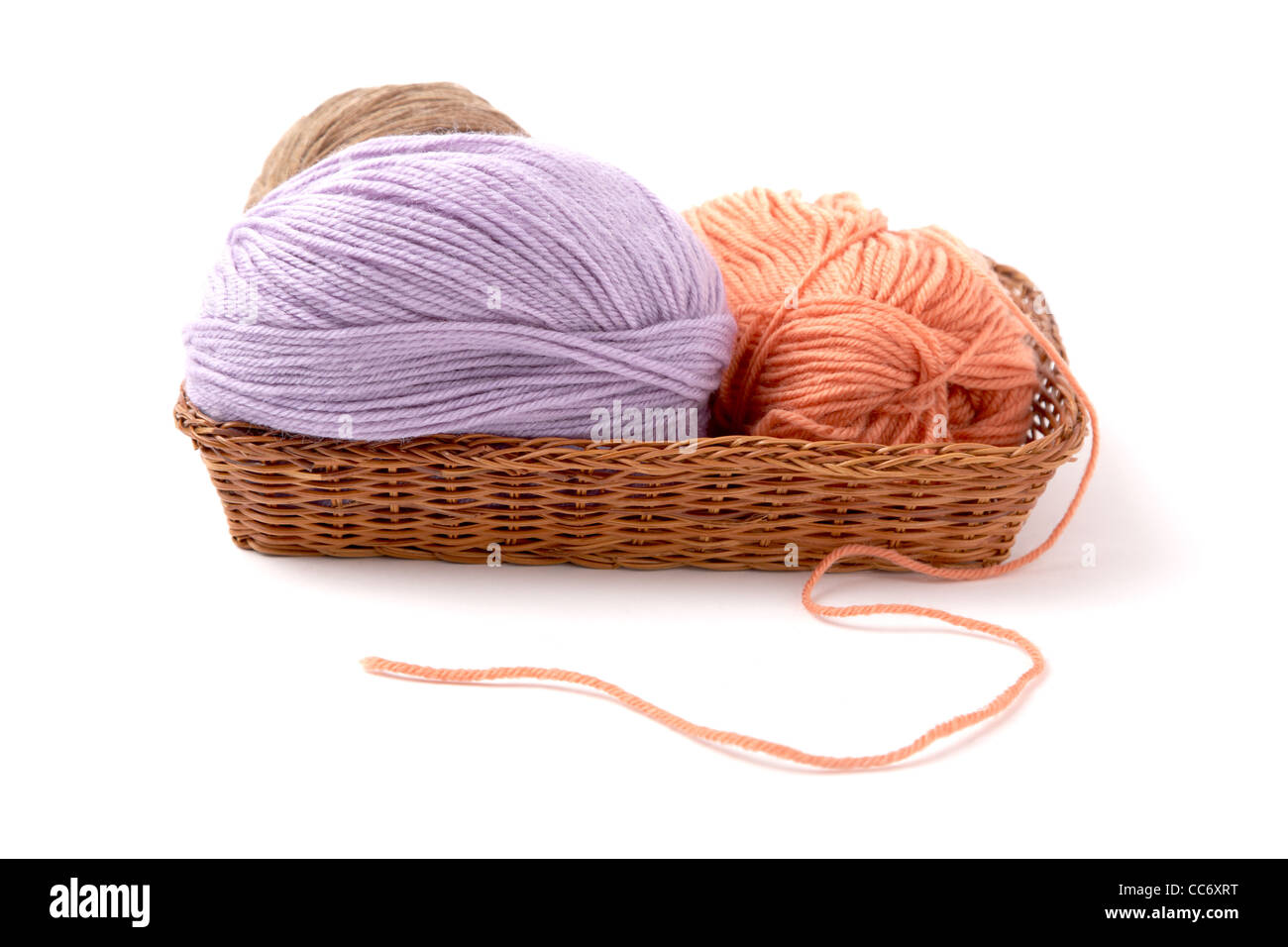 Balls of a yarn knitting in wooden box on white background Stock Photo