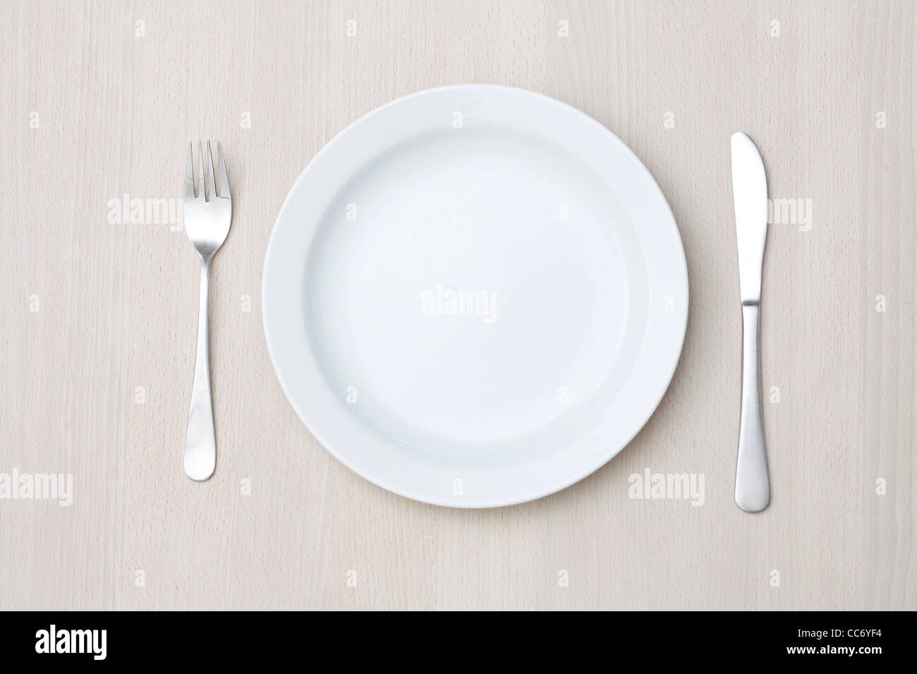 An empty plate on a table Stock Photo