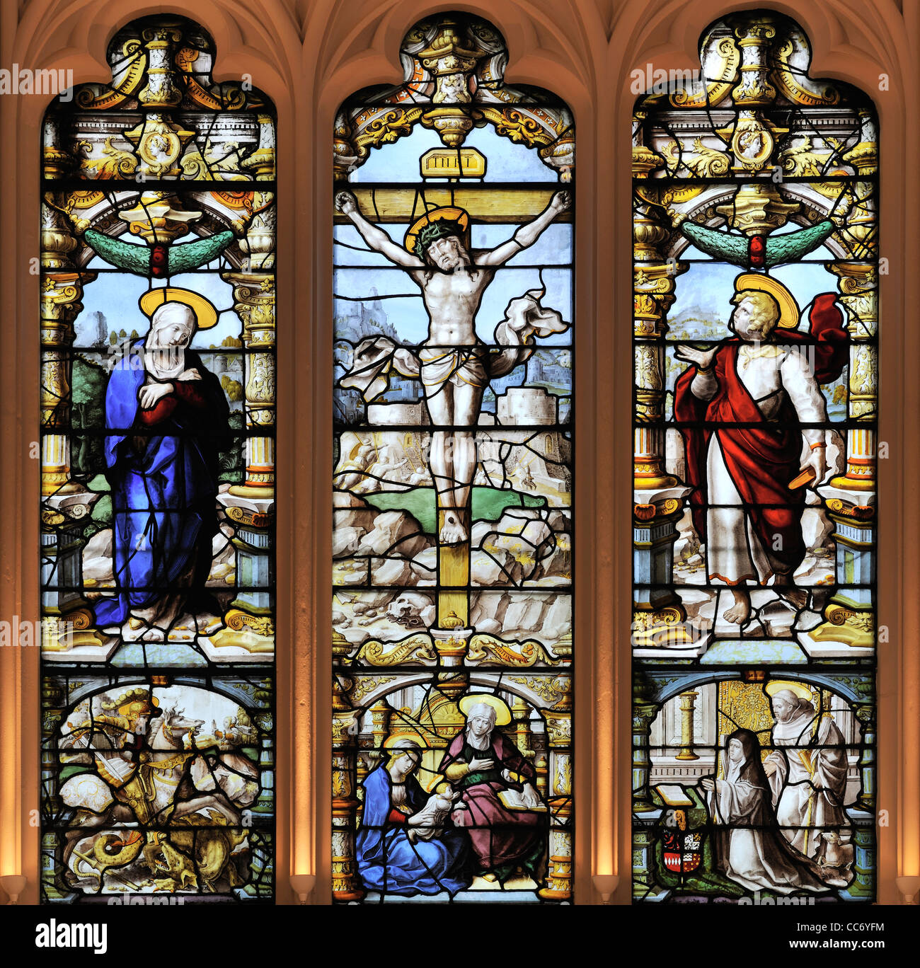 The ornate Flemish East window of St Giles Church, Ashtead, Surrey, England Stock Photo