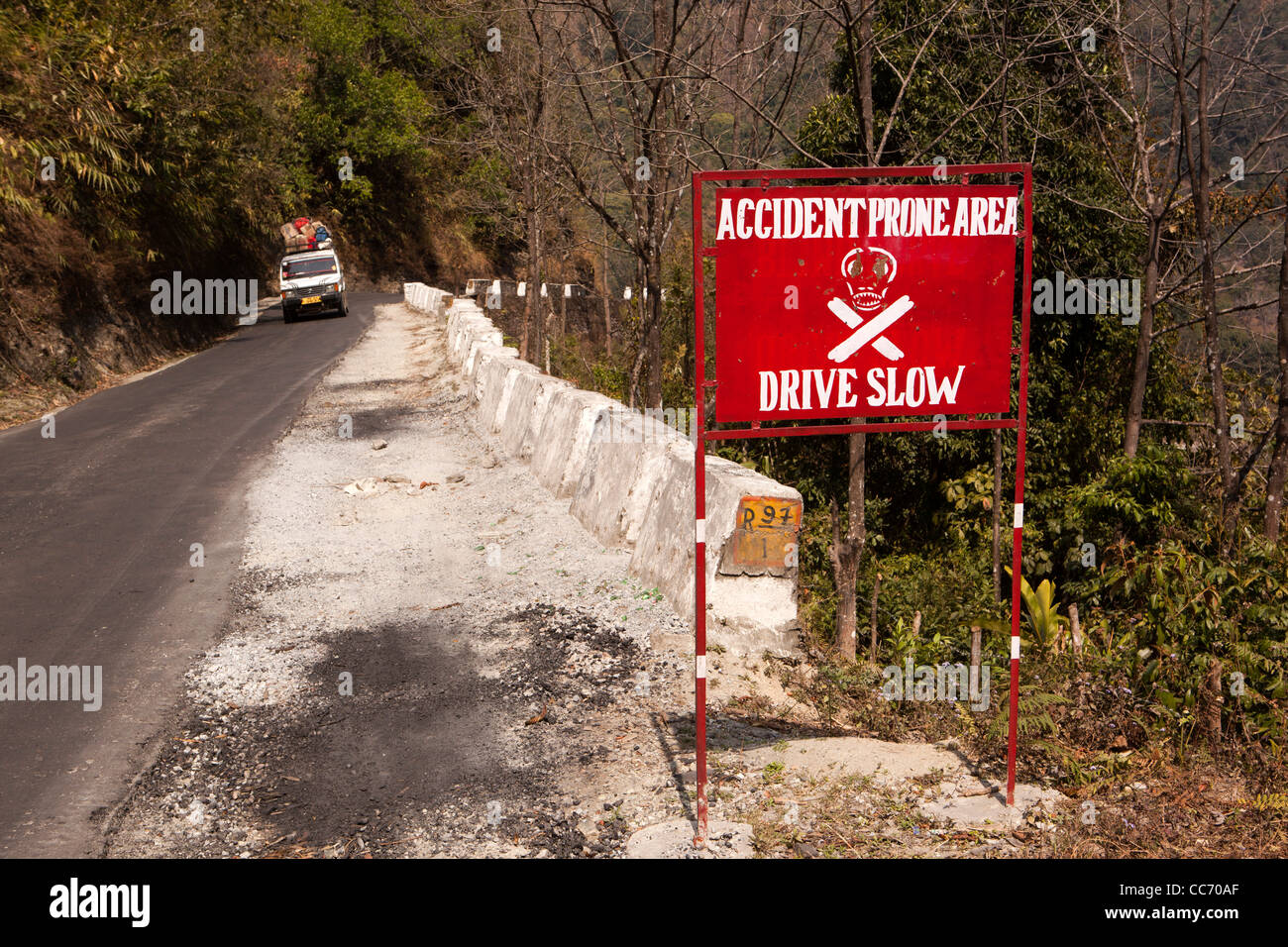 India, Arunachal Pradesh, West Kameng, district, accident prone area warning sign on road through Himalayan foothills Stock Photo