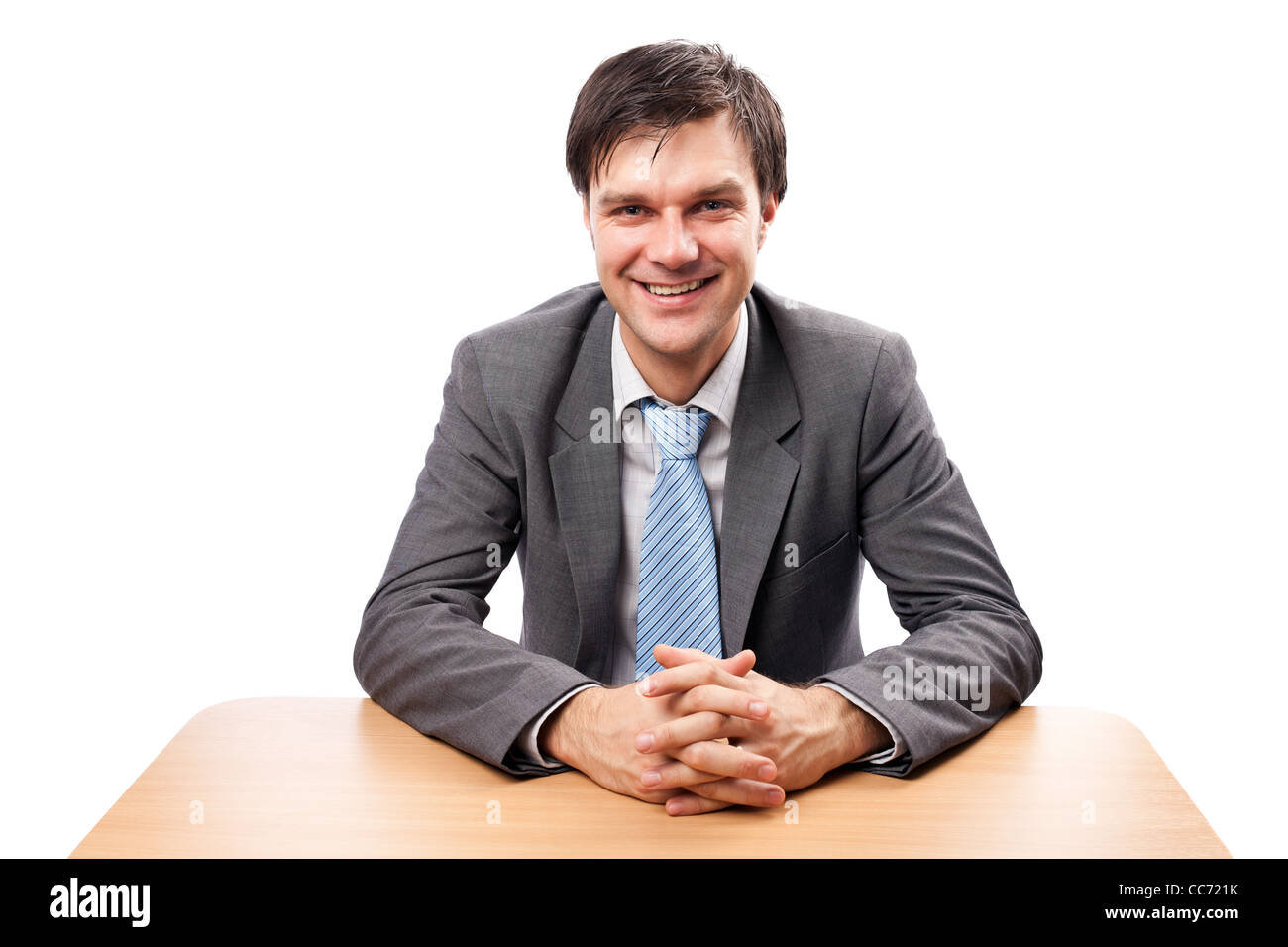 Young businessman at his desk, isolated on white background Stock Photo