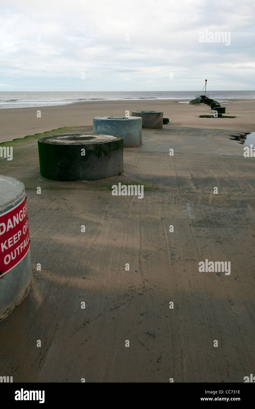On the beach of Mablethorpe, Lincolnshire east coast there is an out fall drain that empties right onto the beach Stock Photo