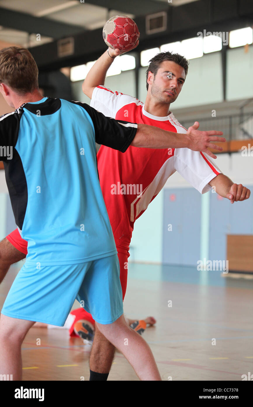 Man throwing ball during handball game Stock Photo Alamy
