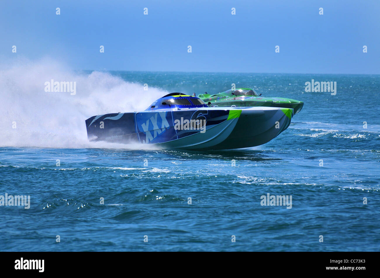 High power race boats speed across waterway during a race. Stock Photo