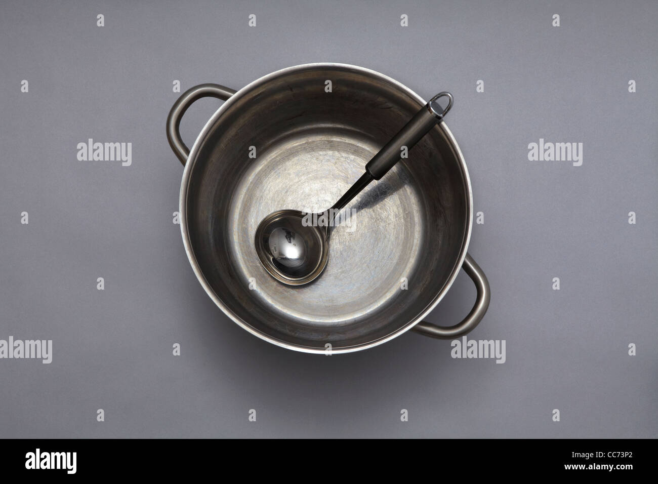 Large metal cooking pot with spoon Stock Photo