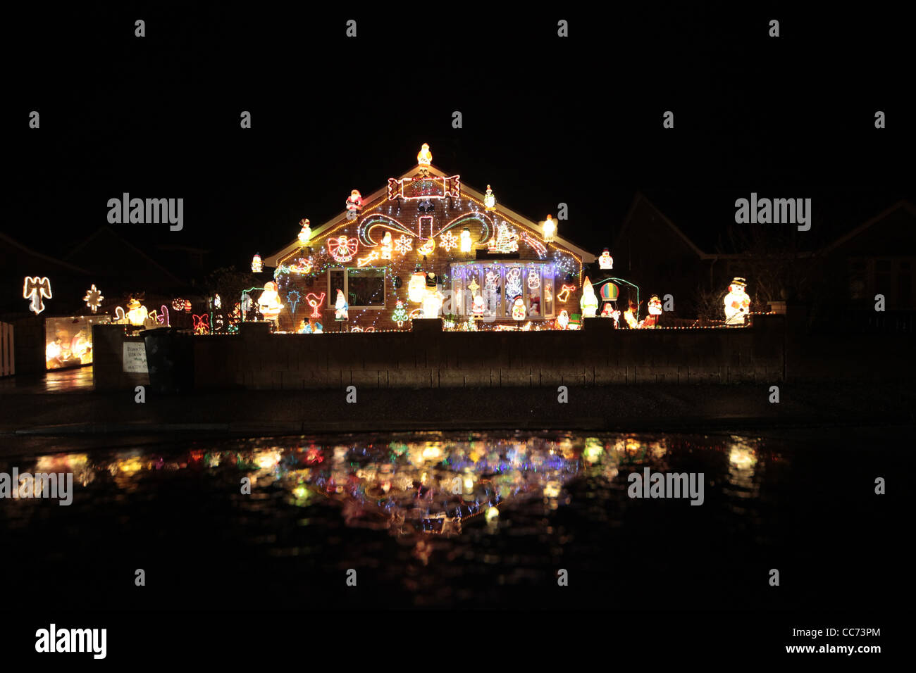 CHRISTMAS LIGHTS ON BUNGALOW RILLINGTON NORTH YORKSHIRE 30 December 2011 Stock Photo