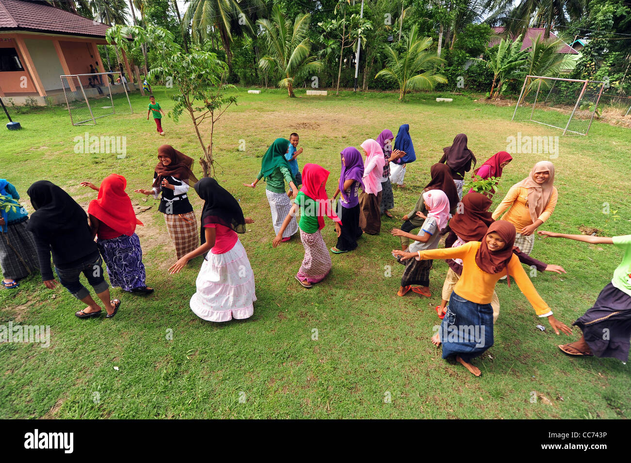 Indonesia, Sumatra, Banda Aceh, adolescents dancing in school yard Stock Photo