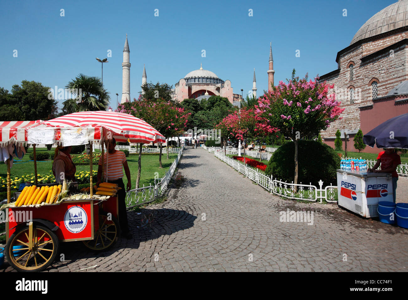 Turkey, Istanbul. Street vendors at Sultan Ahmed square with Hagia Sophia aka Saint Sophia Mosque in the background Stock Photo