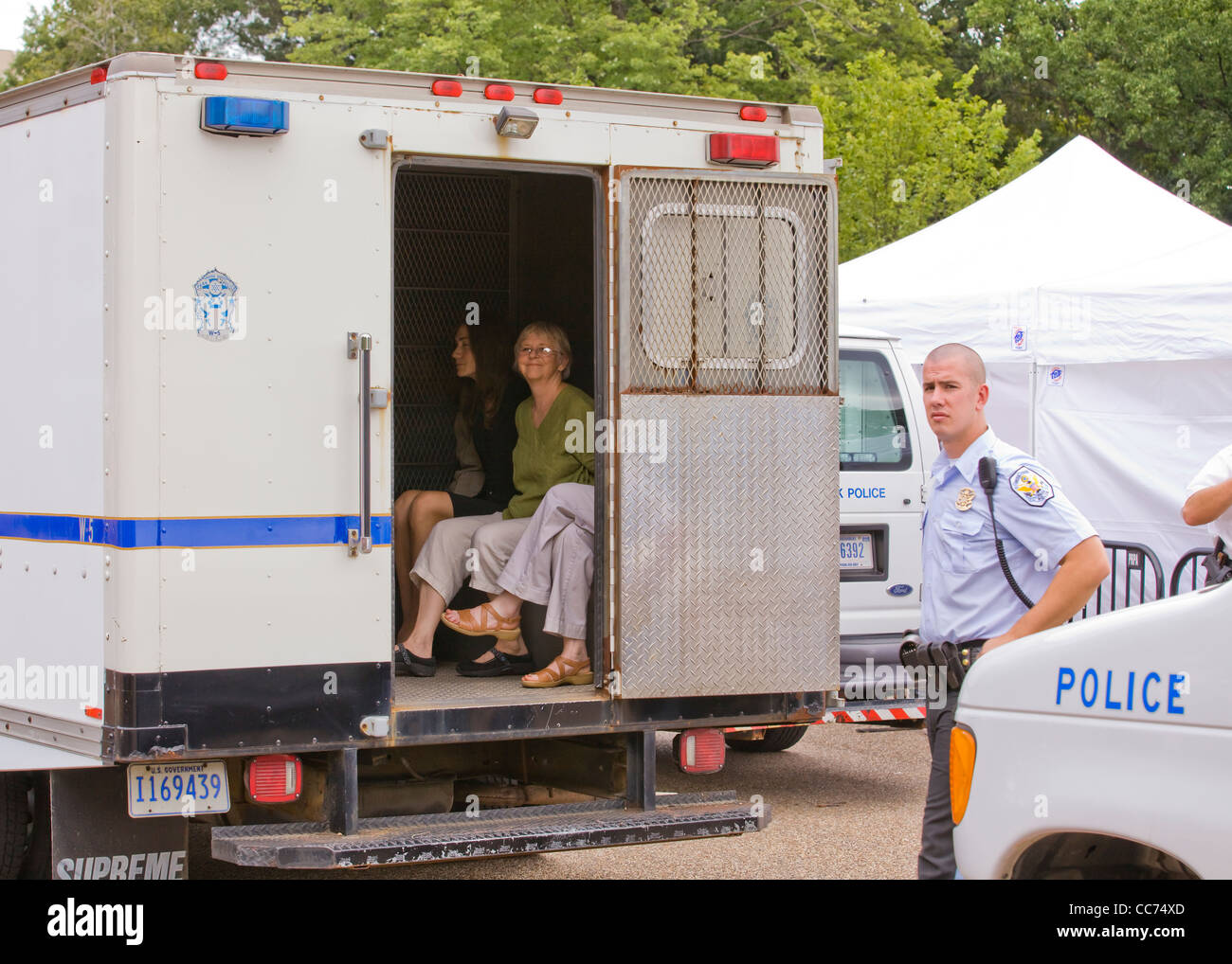 Police detained women sit in a paddy wagon - Washington, DC USA Stock Photo