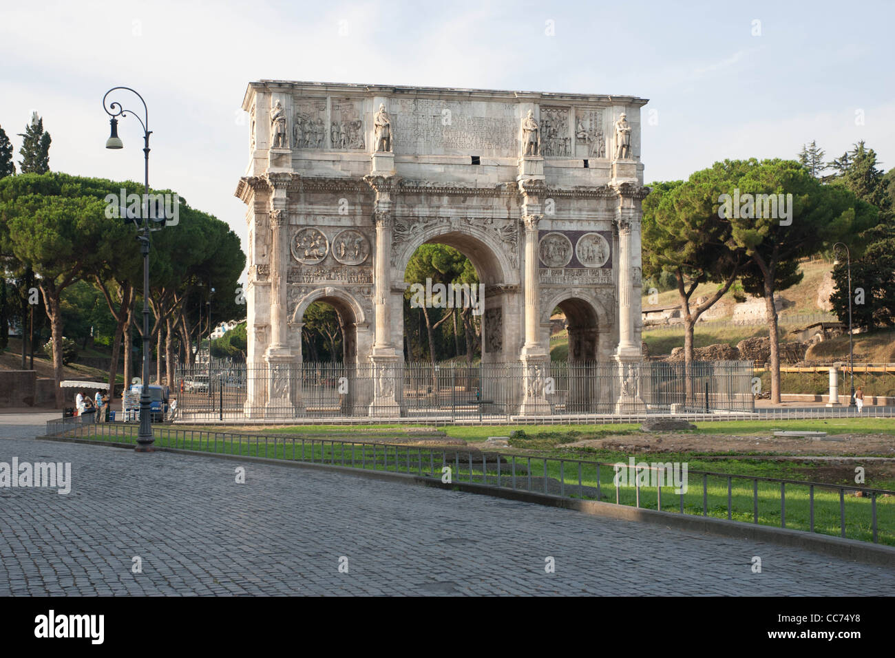 This huge triumphal arch (21 meters high), with three barrel-vaulted passageways, was erected to commemorate Constantine's victory over Maxentius at the Battle of Milvian Bridge in 312. It is just west of the Colosseum and dwarfs the nearby Arch of Titus. It incorporates recycled sculpture from earl Stock Photo