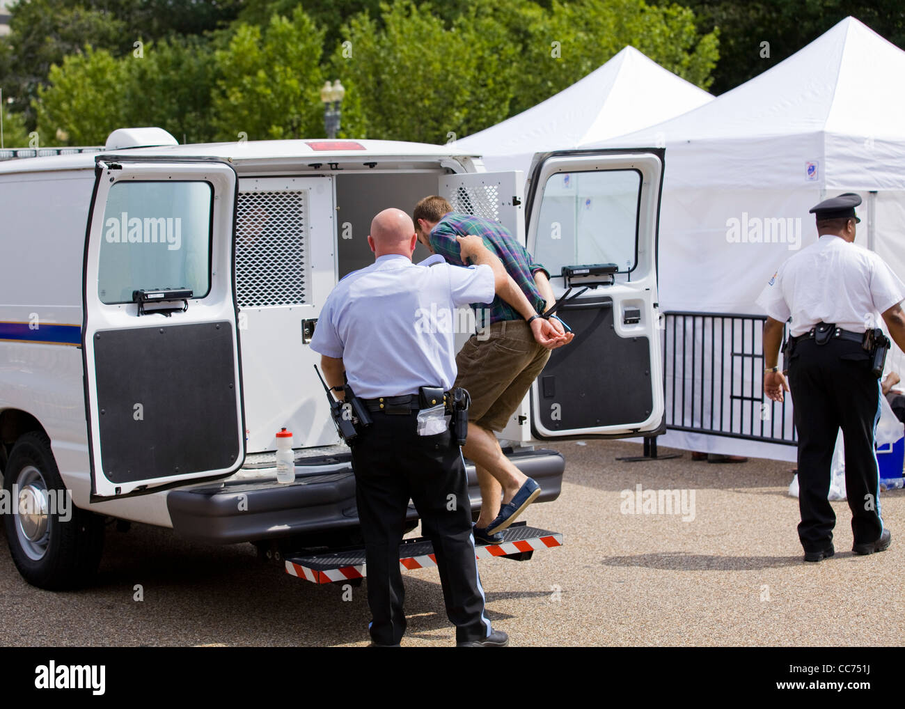 Police detained man led into paddywagon - Washington, DC USA Stock Photo