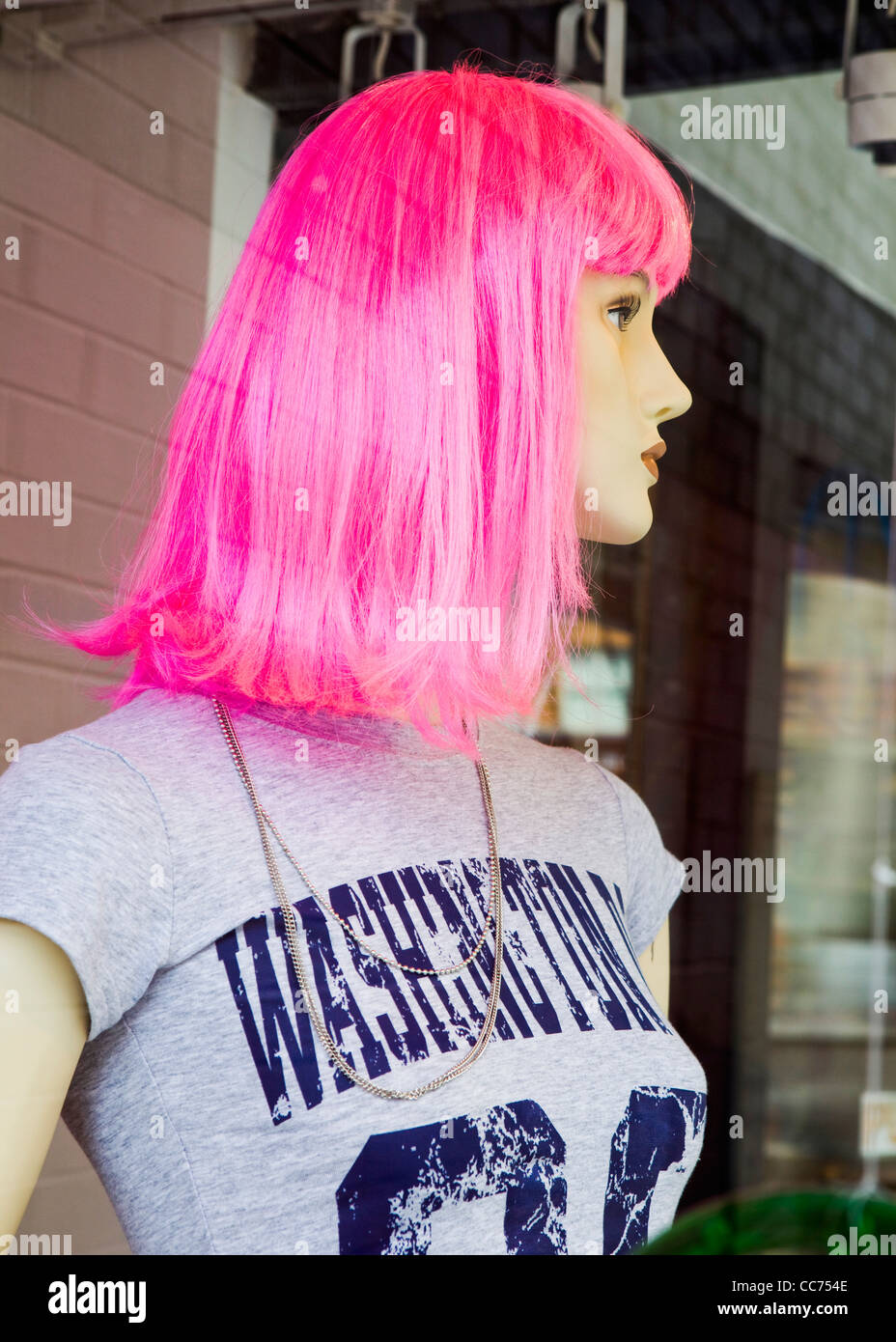 Display manikin wearing pink wig Stock Photo