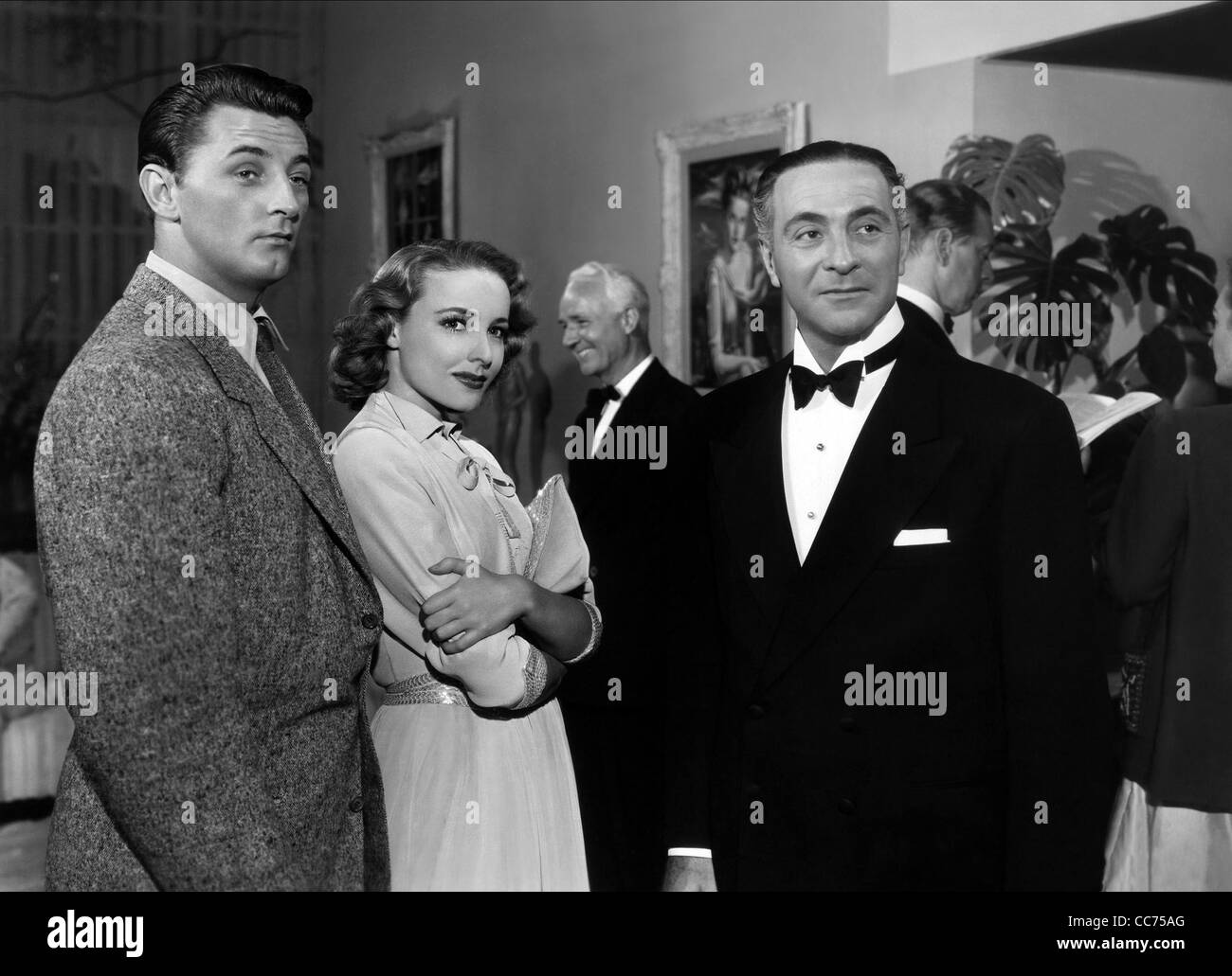 ROBERT MITCHUM, LARAINE DAY, BRIAN AHERNE, THE LOCKET, 1946 Stock Photo