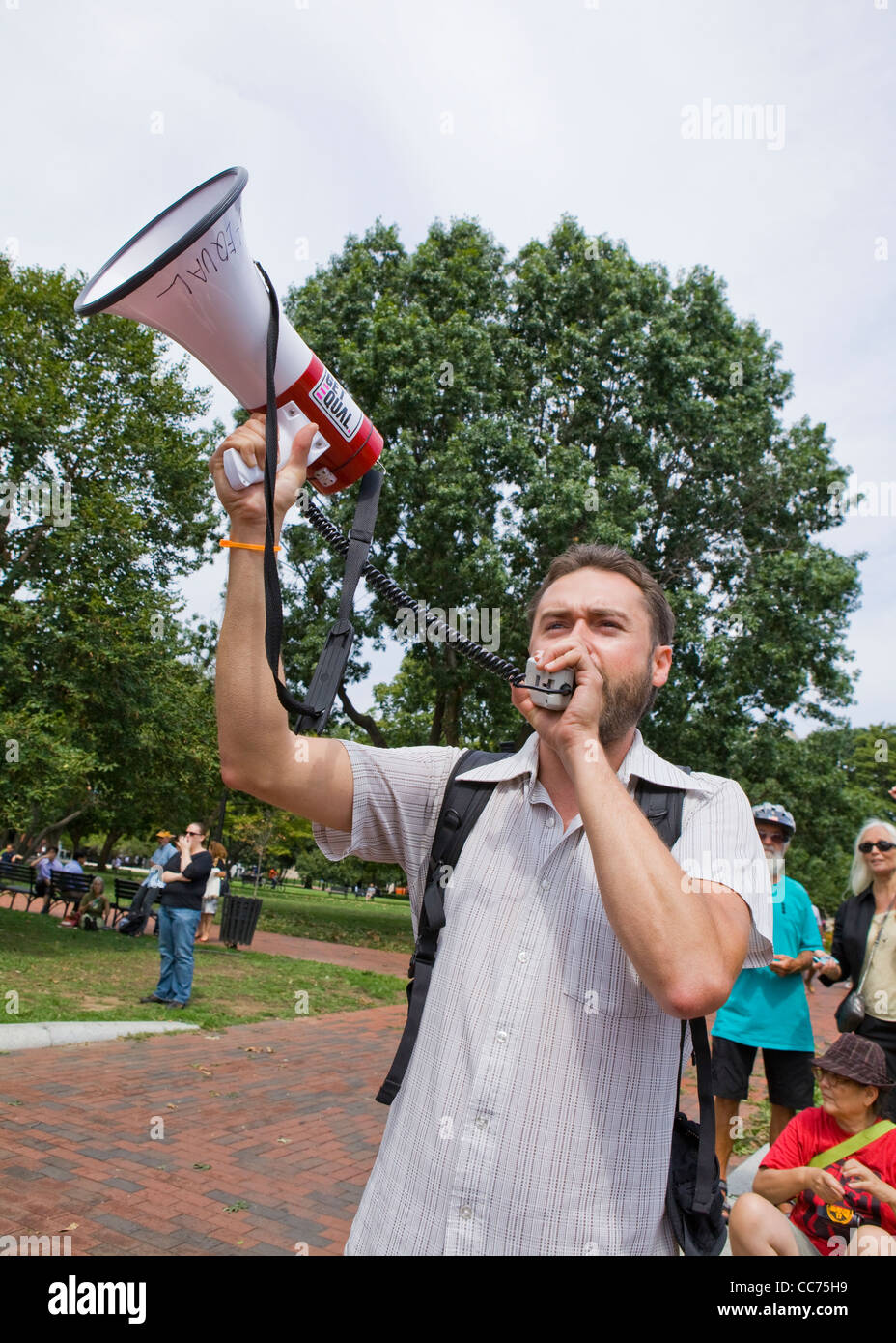 Protester speaking through a bullhorn Stock Photo