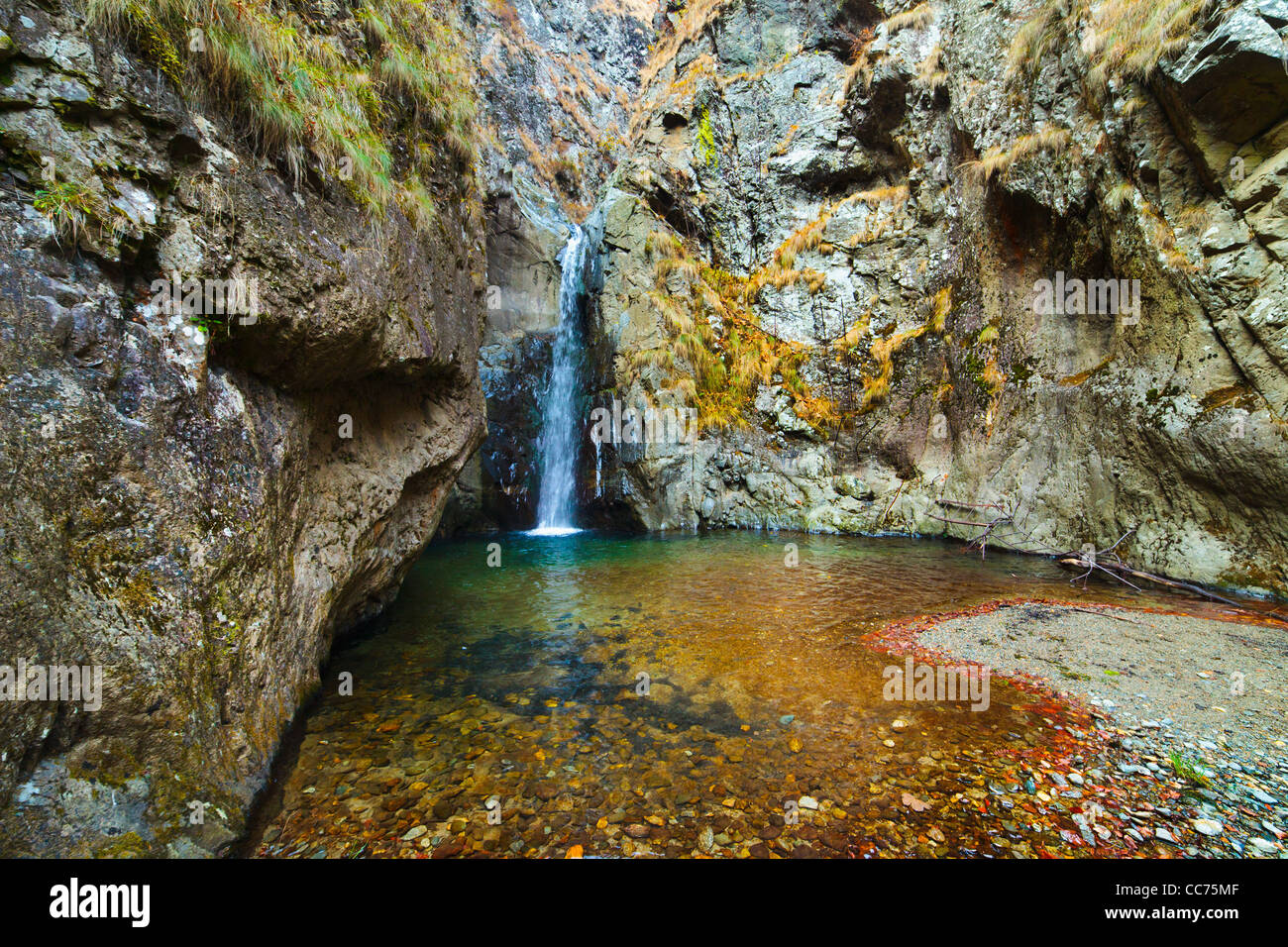 Landscape with waterfall in the mountains Stock Photo - Alamy