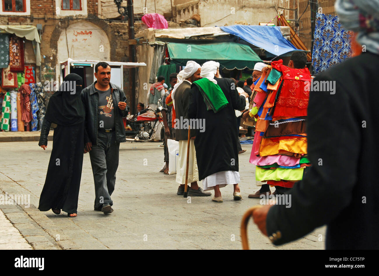 Yemen, Sanaa, view of people walking on street in market Stock Photo