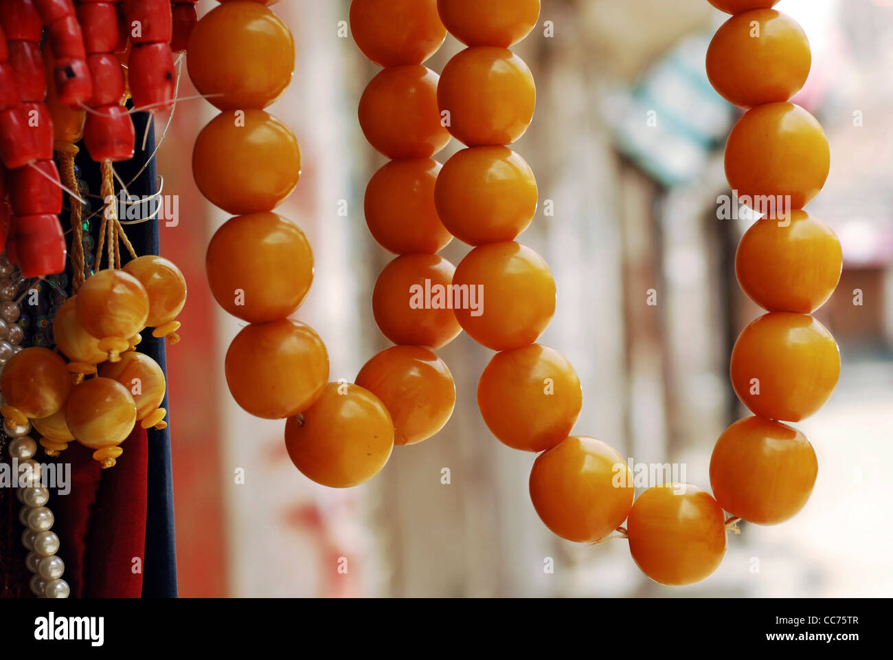 Yemen, Sanaa, close-up on orange prayer beads Stock Photo