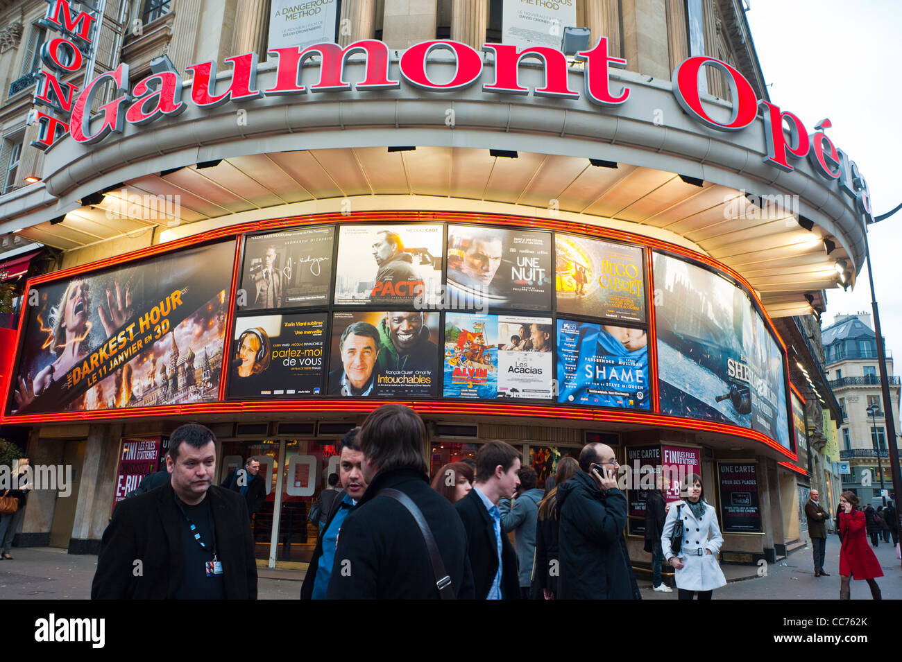 Paris, France, Front of French Movie Theatre Marquee, Gaumont Opera, Large FIlm Posters, Cinema Sign, billboards people talking outside theater Stock Photo