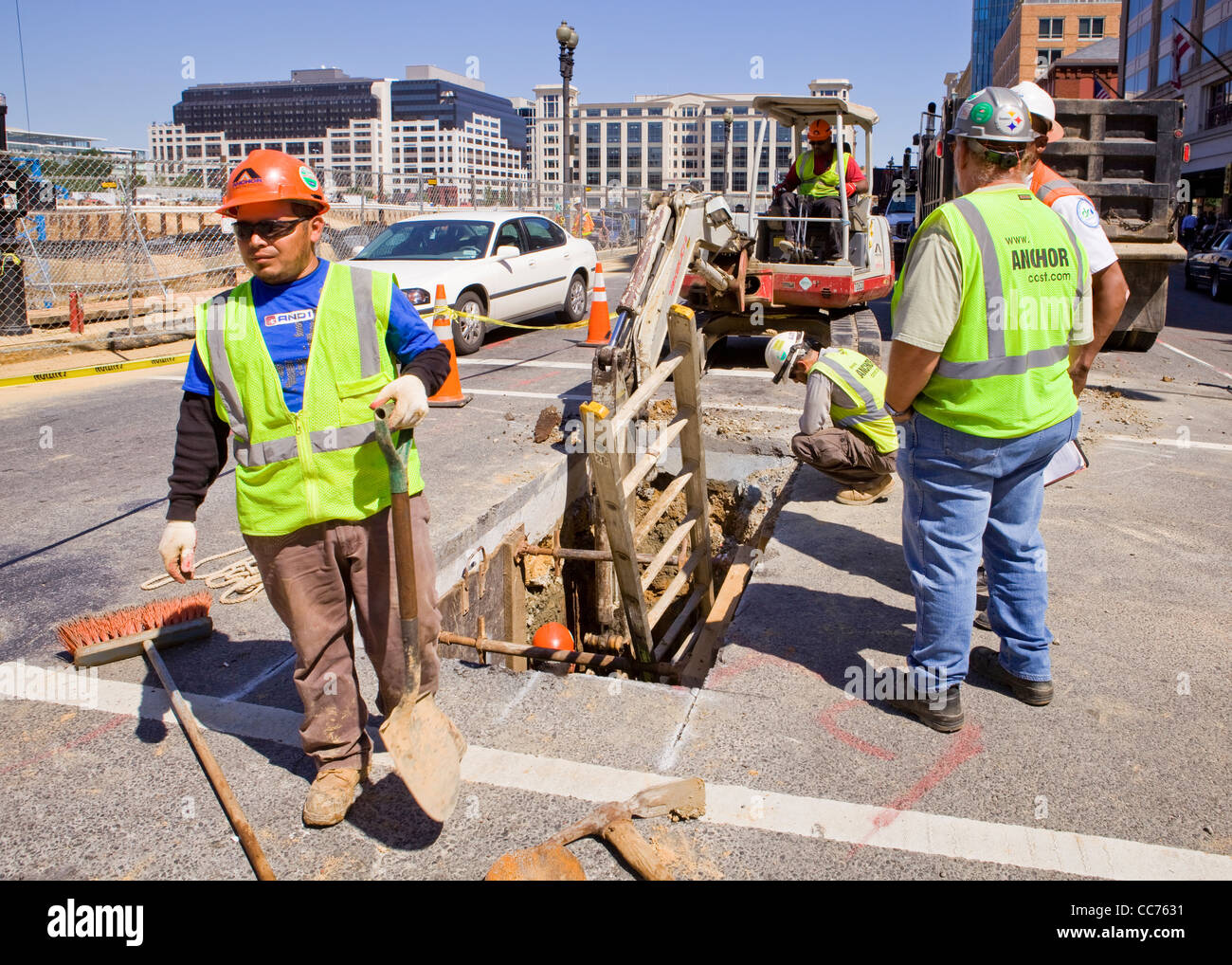 Municipal construction workers digging in city street - Washington, DC USA Stock Photo