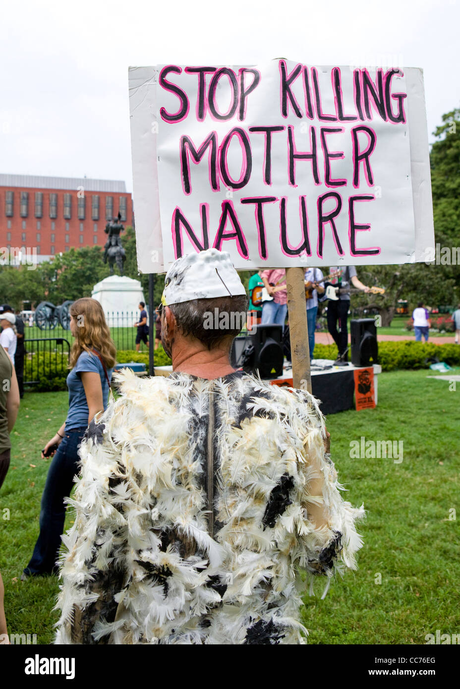 An environmental activist protesting with a picket Stock Photo