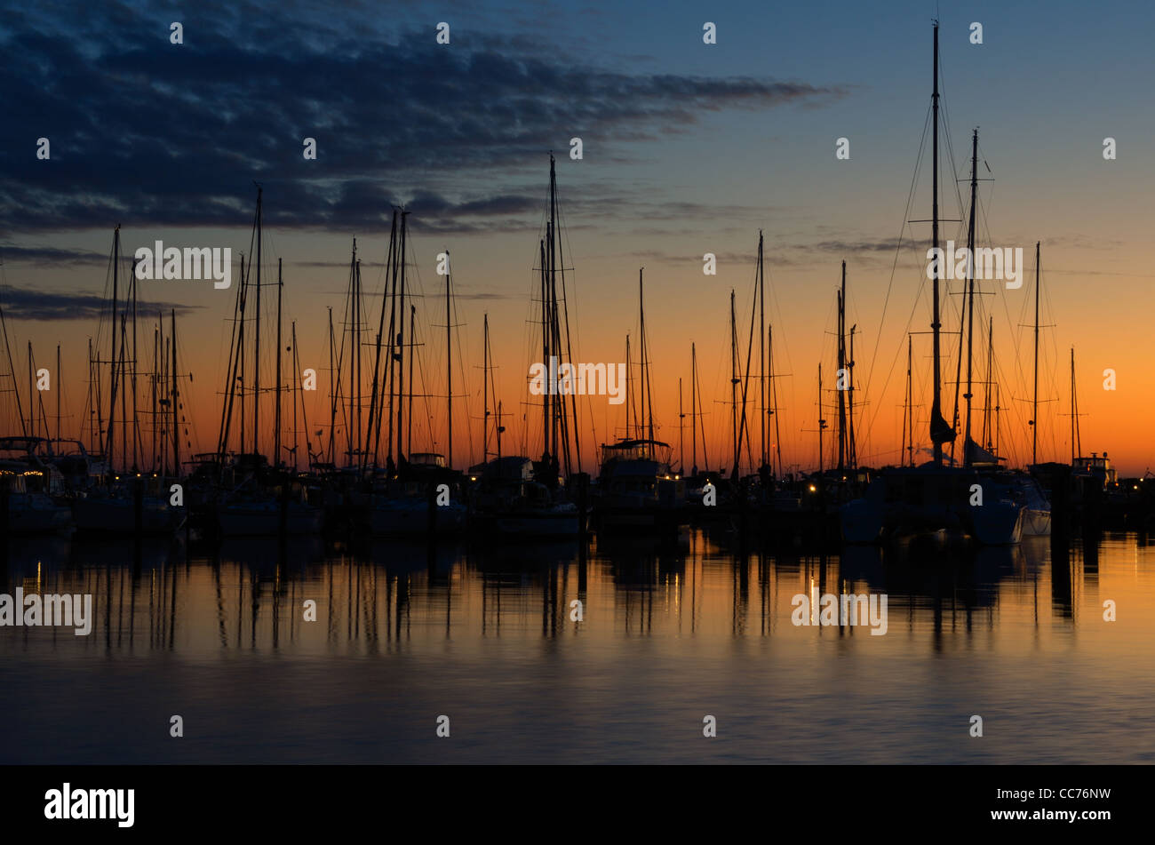 docked boats silhouetted against the morning sky Stock Photo - Alamy