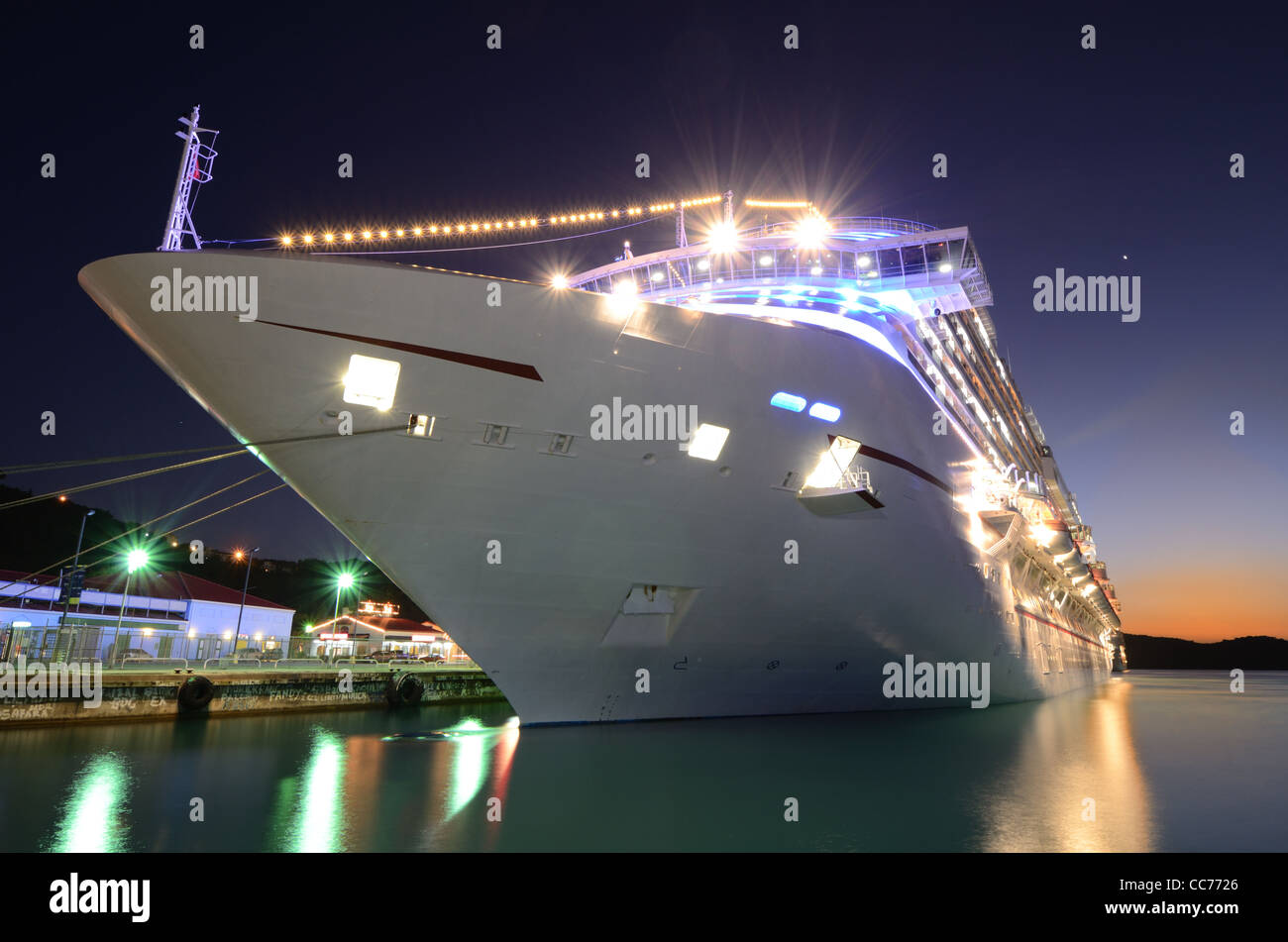 Cruise ship docked at twilight Stock Photo